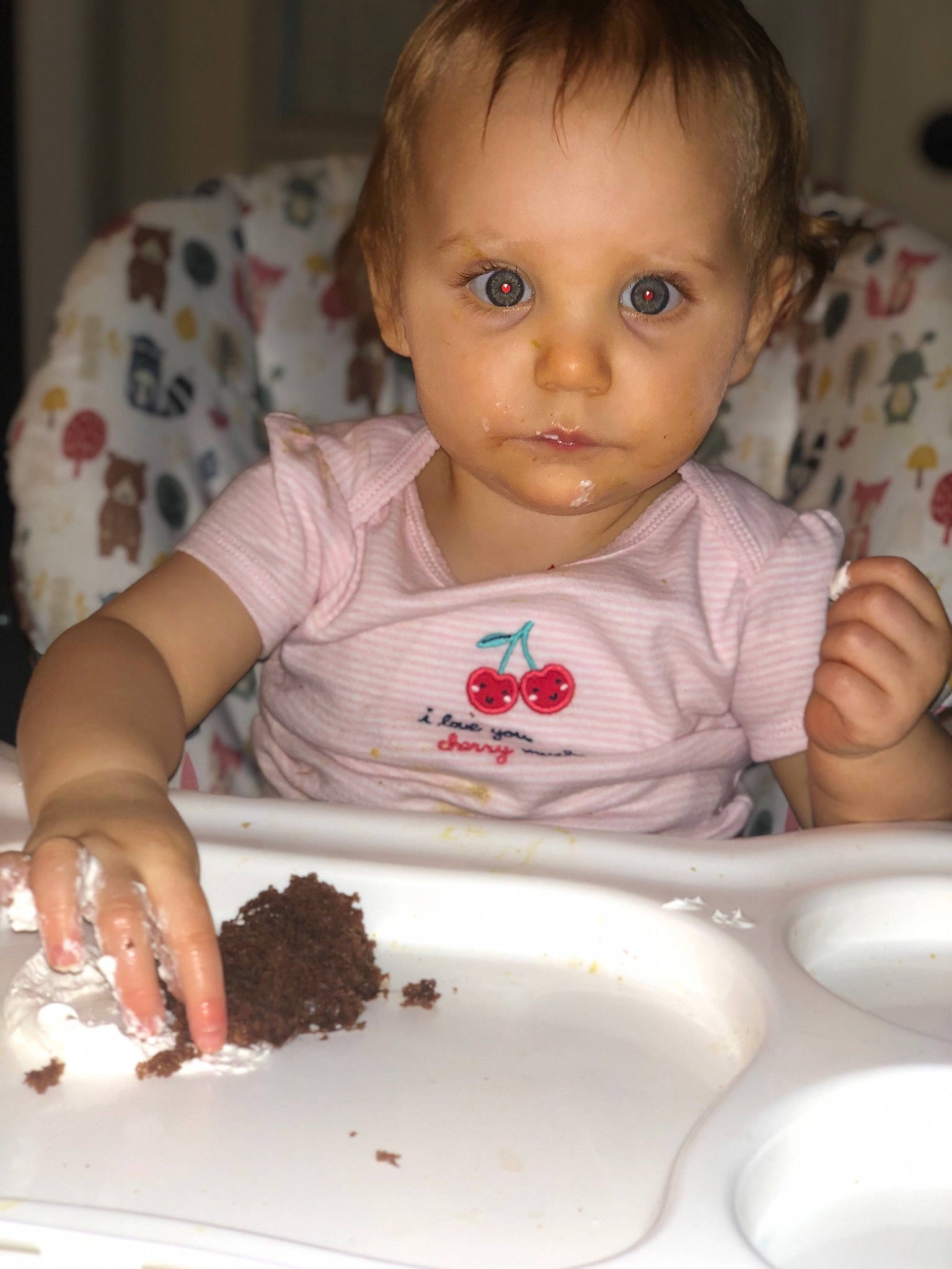 Ava is registered to the contest to win money with this photo: baby, baked_goods, birthday_cake, cake, cake_decorating, chair, cheek, child, cuisine, dish, dishware, finger, food, food_craving, hairstyle, nose, person, plate, recipe, tableware