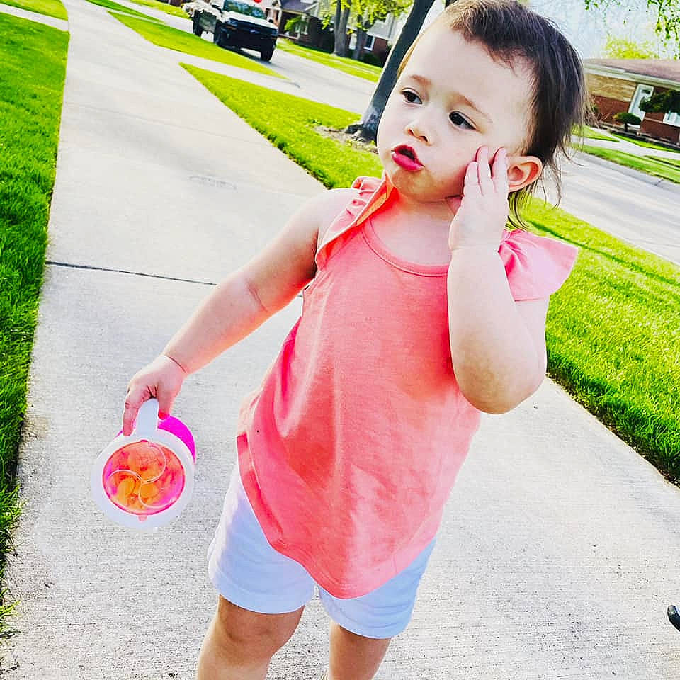 Ravyn joined the competition — help win amazing prizes! asphalt, baby_toddler_clothing, child, dress, finger, fun, gesture, grass, green, happy, leisure, morning, people_in_nature, person, photograph, pink, plant, shorts, sleeve, summer