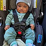Chosen is registered to the contest to win money with this photo: baby, baby_clothes, blanket, car_seat, child, clothing, comfort, cute, face, hat, headwear, indoors, infant, portrait, safety, seatbelt, smiling, socks, straps, young_child