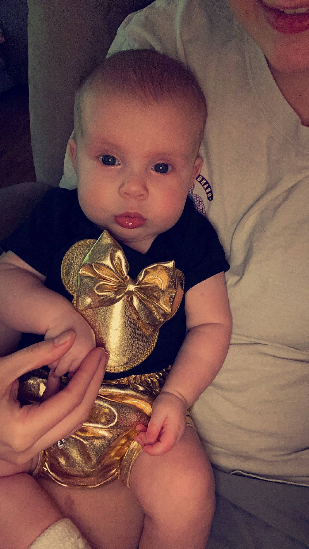 Olivia is registered to the contest to win money with this photo: baby, baby_toddler_clothing, brown_hair, chest, child, elbow, finger, hand, happy, head, human_leg, nail, organ, person, sitting, skin, sleeve, thumb, toddler, trunk