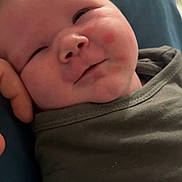 Carter joined the competition — help win amazing prizes! baby, infant, smiling, face, cheeks, hand, blanket, clothing, closeup, resting, skin, newborn, cute, portrait, indoors, soft, young, child, people, expression