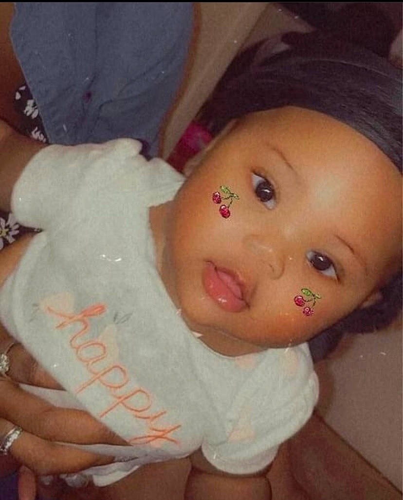 Demi is registered to the contest to win money with this photo: baby, baby_toddler_clothing, cheek, chest, cool, doll, eyelash, finger, forehead, headgear, human_body, iris, lip, mouth, nose, person, pink, skin, thumb, toy