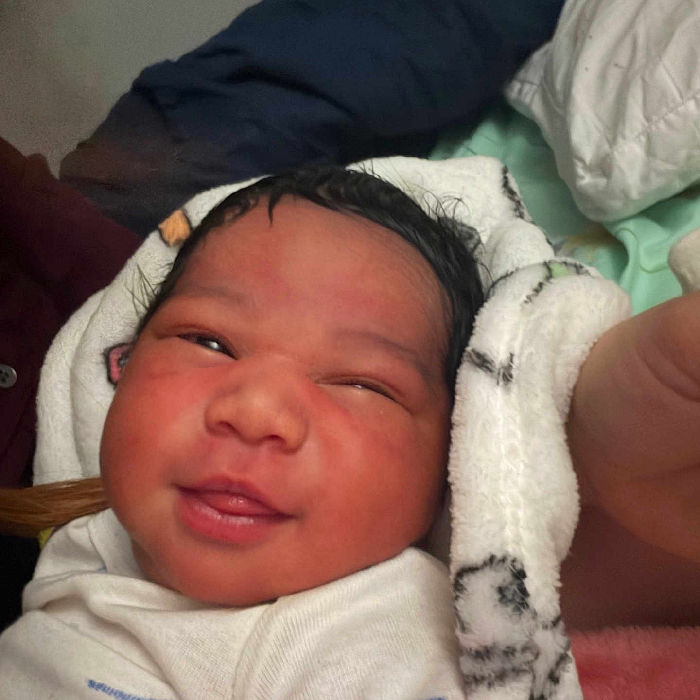 Xavier joined the competition — help win amazing prizes! newborn, baby, infant, face, blanket, white_clothing, skin, hair, indoors, person, portrait, cute, sleepy, cozy, soft, newborn_baby, child, human, smile, closeup