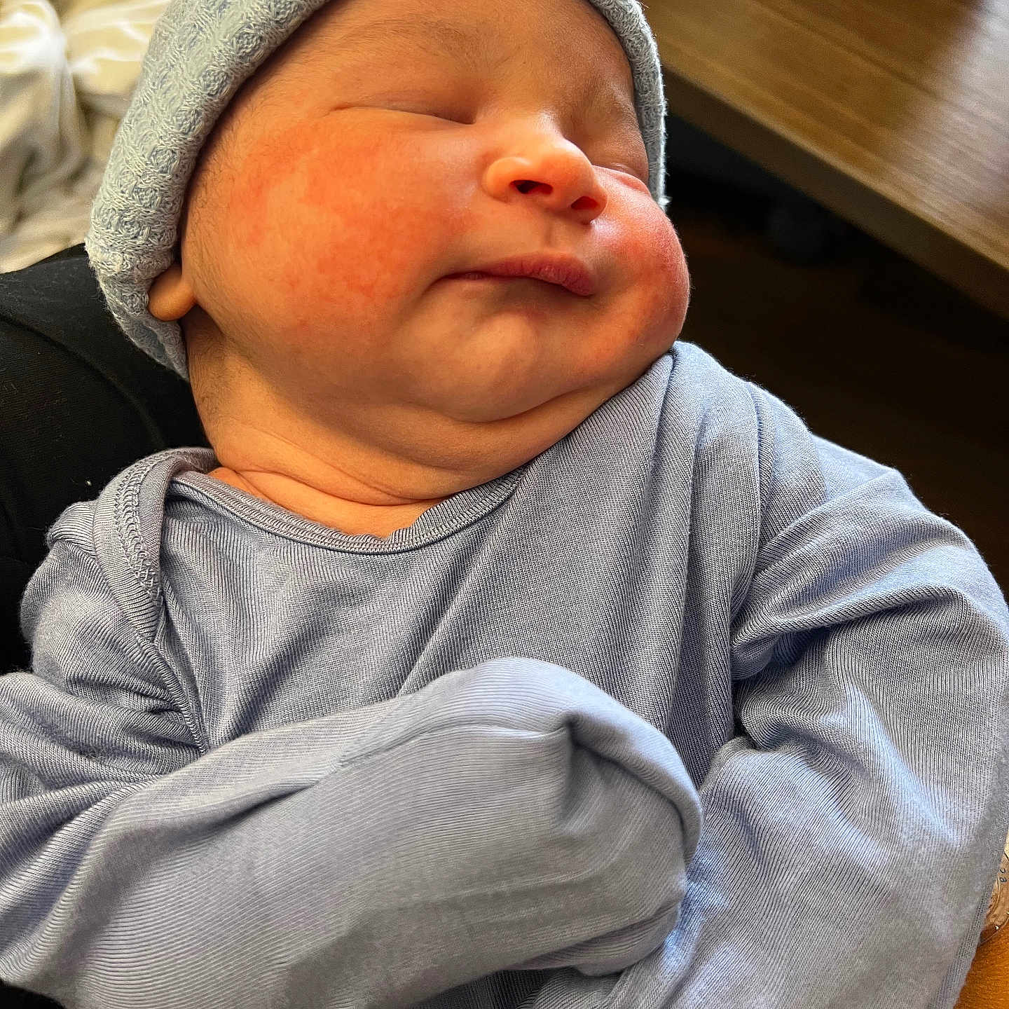 Kaos joined the competition — help win amazing prizes! newborn, baby, sleeping, hat, blue_clothing, rosy_cheeks, infant, cute, soft_light, portrait, cozy, peaceful, child, indoors, closeup, wrinkled_skin, newborn_clothes, resting, tender, warm