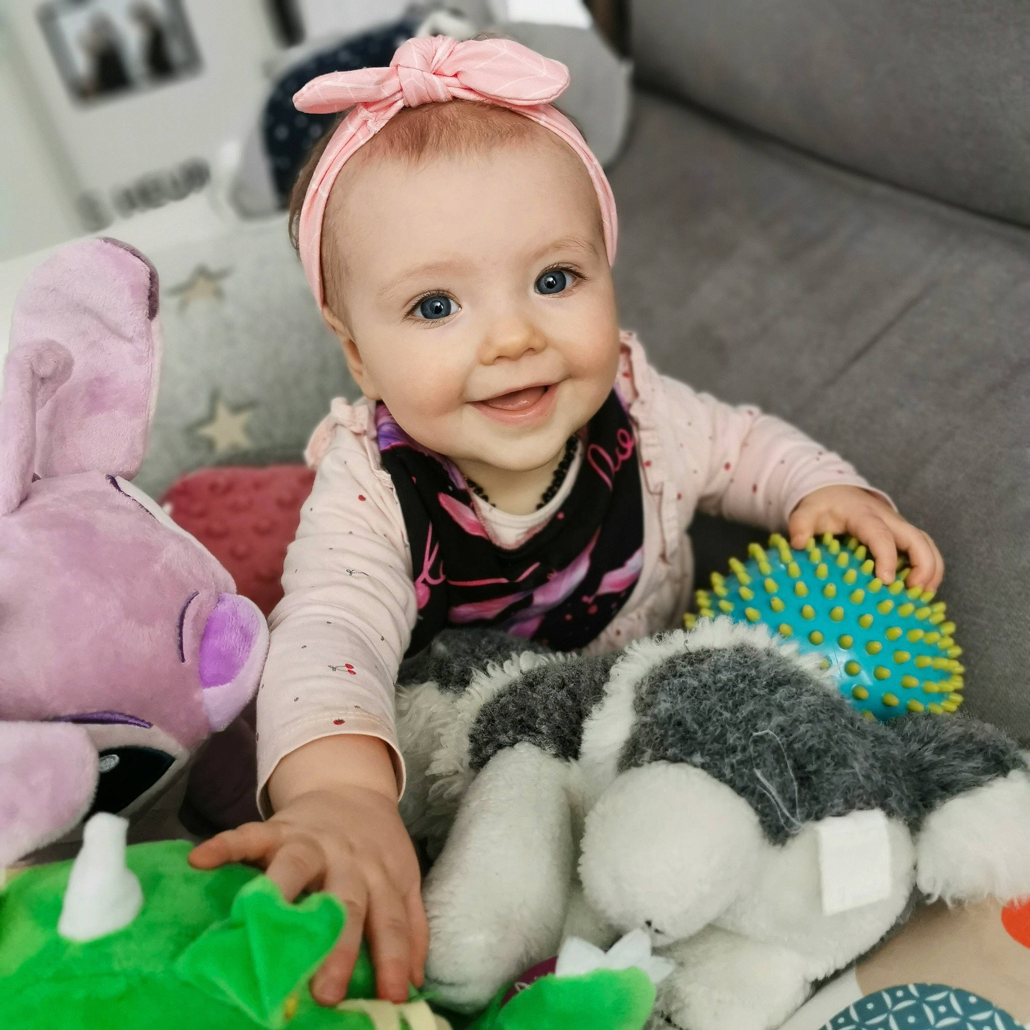 Fallon participe au concours pour gagner de l'argent avec cette photo : baby, baby_playing_with_toys, baby_toddler_clothing, cheek, comfort, facial_expression, finger, green, happy, headgear, joy, person, photograph, pink, product, skin, sleeve, smile, snapshot, textile
