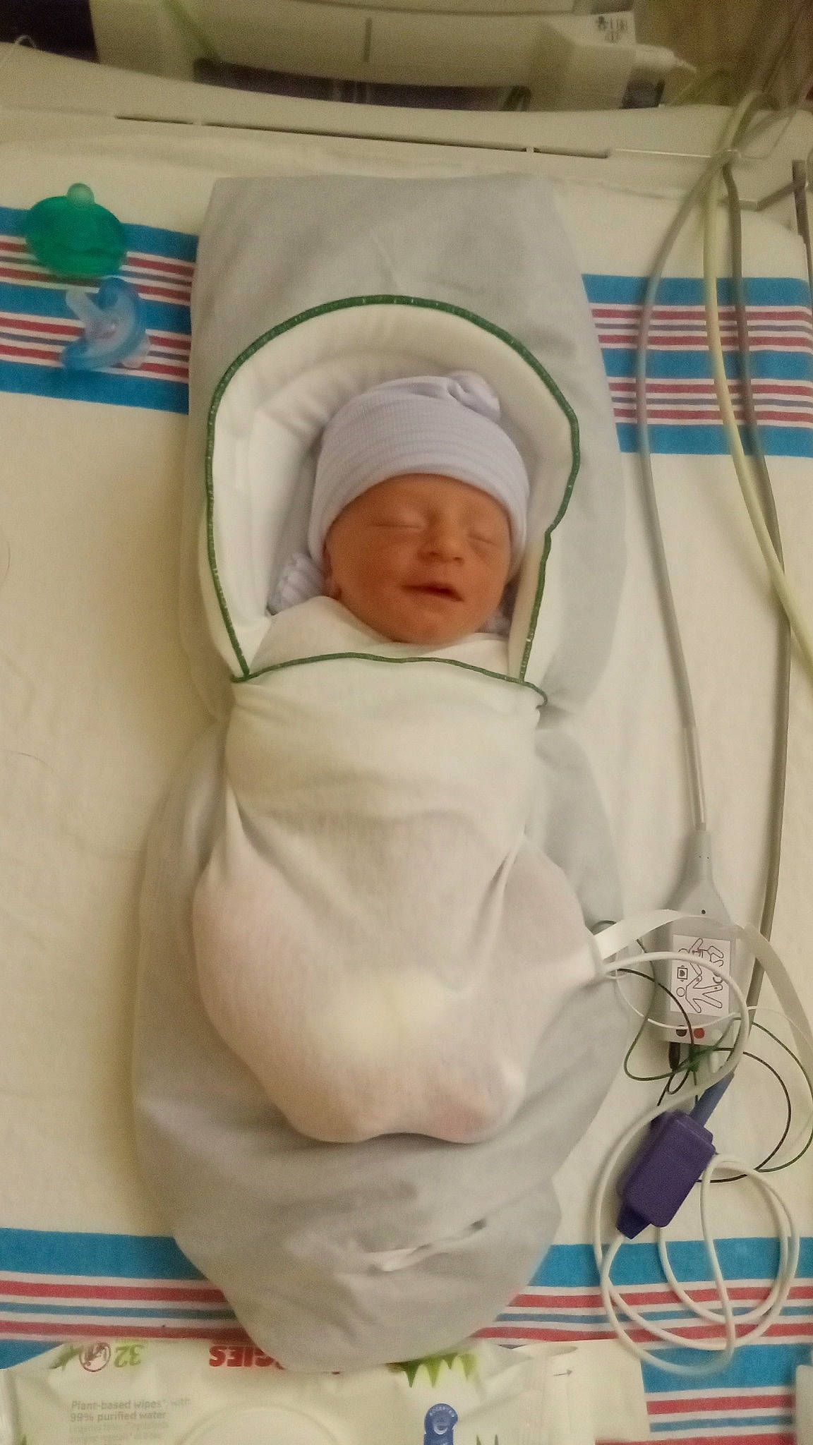 Hudson is registered to the contest to win money with this photo: baby, baby_products, baby_safety, baby_sleeping, baby_toddler_clothing, child, comfort, headwear, infant_bed, linens, person, room, toddler