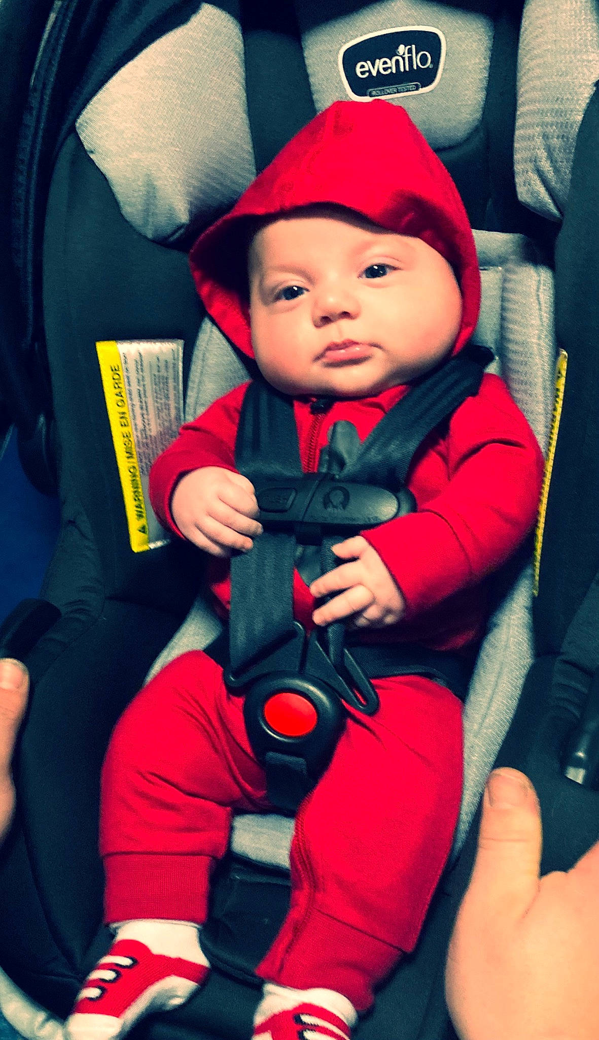 Zander joined the competition — help win amazing prizes! baby, baby_carriage, baby_toddler_clothing, cap, car_seat, child, comfort, cool, electric_blue, facial_expression, finger, fun, gesture, hand, headwear, lap, magenta, person, red, thigh