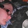 Rosey joined the competition — help win amazing prizes! affection, animal, blanket, close_up, comfort, cozy, cuddle, dog, eyewear, face, glasses, hand, indoor, person, pet, portrait, resting, sleepy, tattoo, warmth