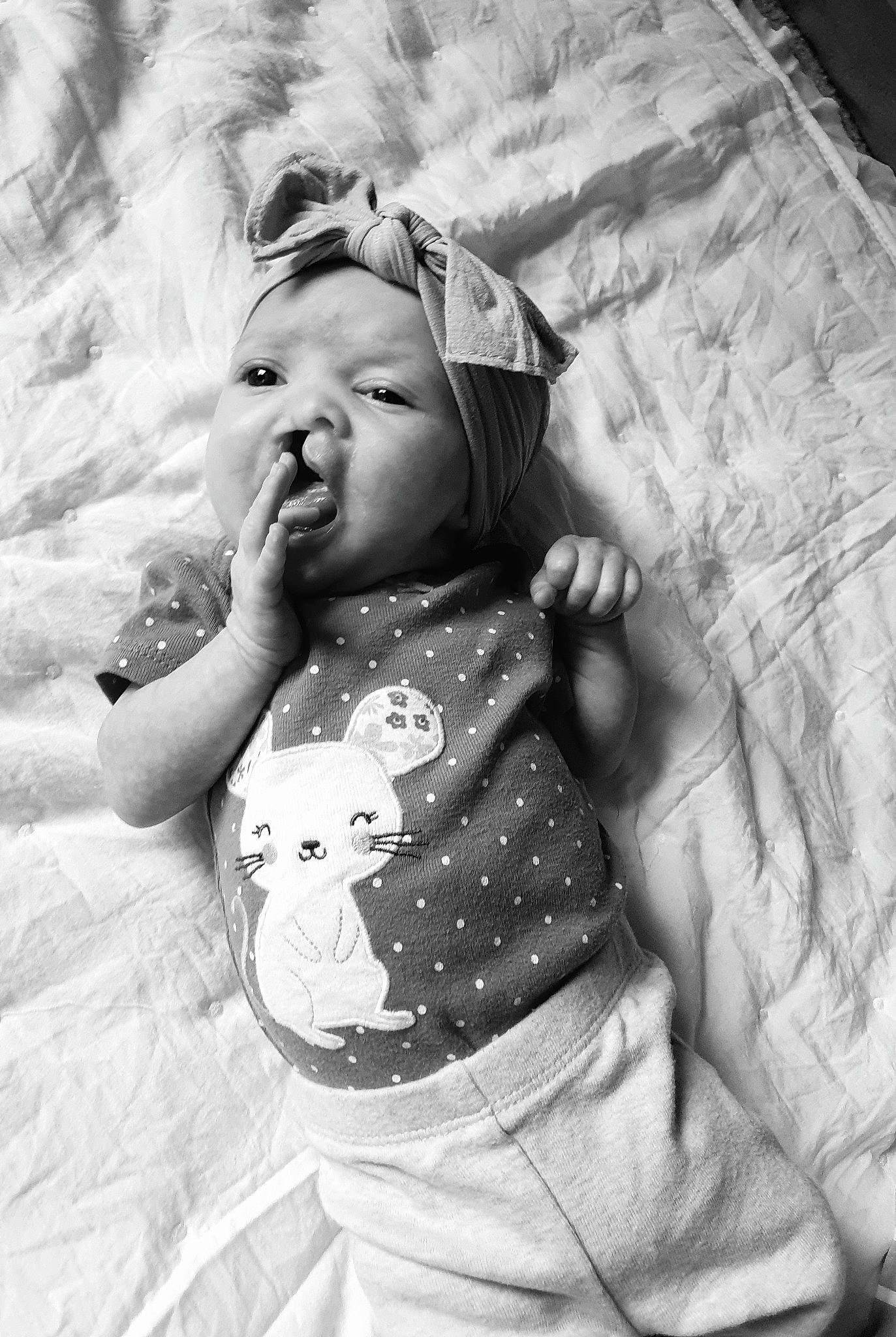 Astrid is registered to the contest to win money with this photo: baby, baby_products, baby_toddler_clothing, bed, bed_sheet, bedding, child, linens, person, toddler