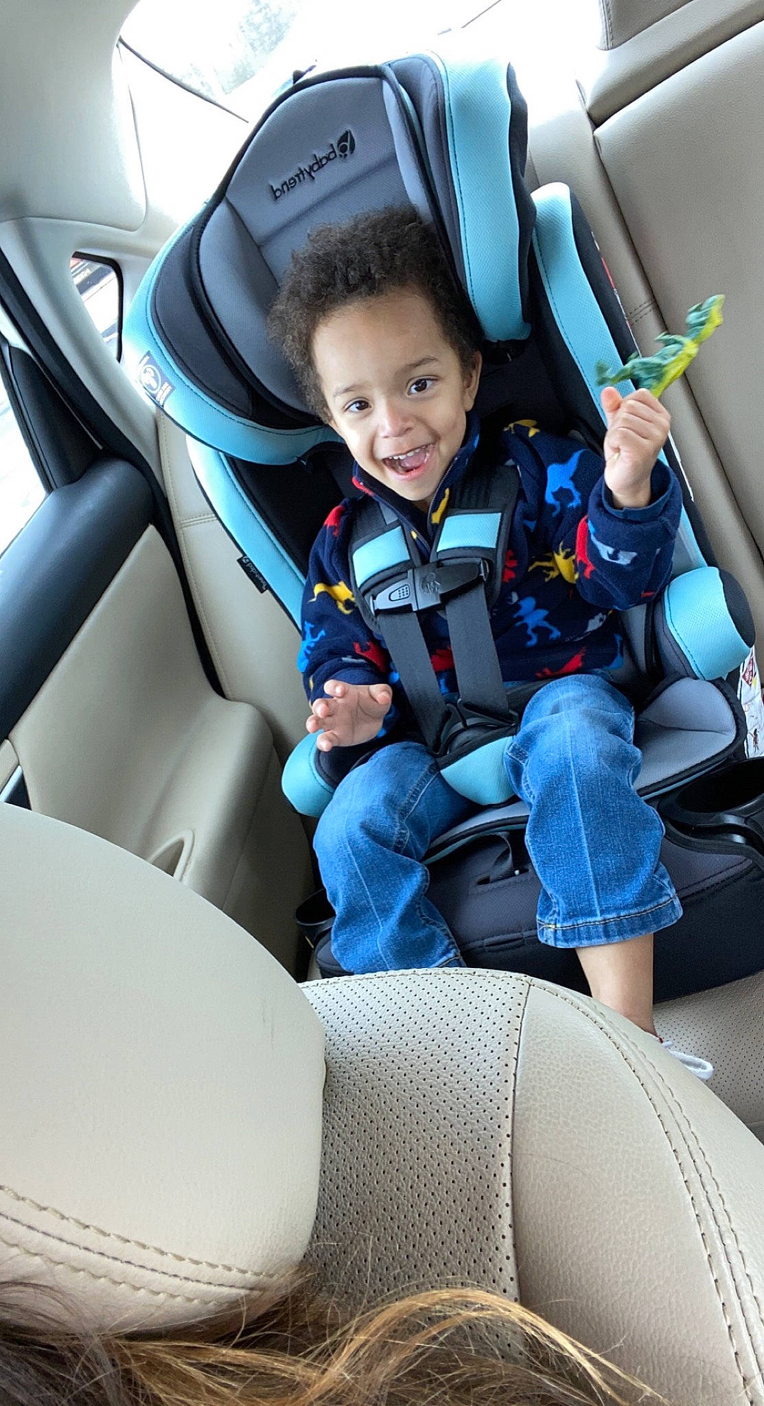 Aiden is registered to the contest to win money with this photo: auto_part, automotive_design, automotive_exterior, car, car_seat, car_seat_cover, comfort, electric_blue, head_restraint, joy, mode_of_transport, motor_vehicle, person, personal_luxury_car, seat_belt, smile, steering_part, steering_wheel, toddler, vehicle