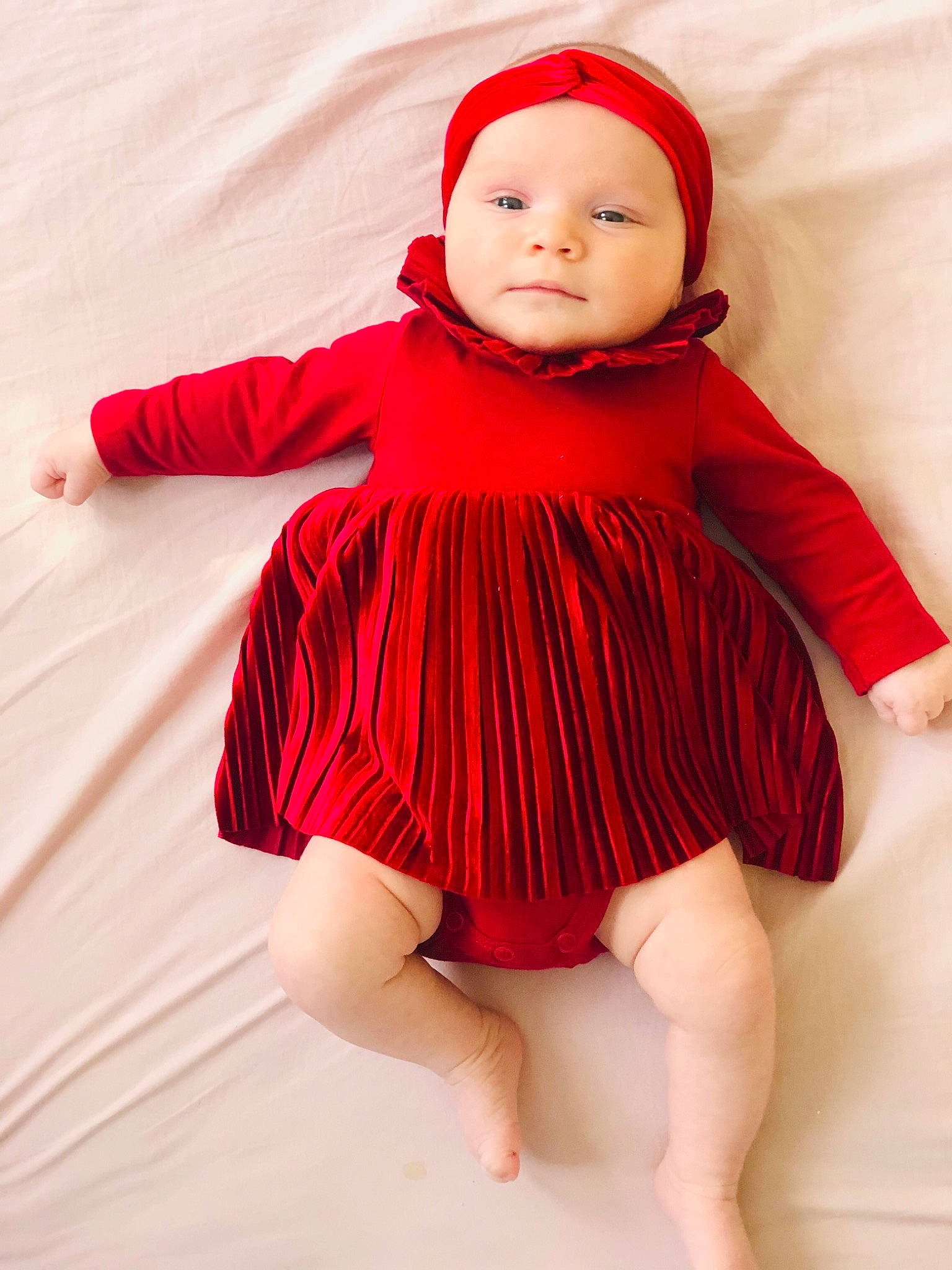 Nicole a rejoint le concours — aidez-le/la à gagner de superbes lots ! baby, baby_toddler_clothing, cap, child, collar, day_dress, dress, face, happy, headwear, human_body, human_leg, magenta, one_piece_garment, pattern, person, pink, red, skin, sleeve