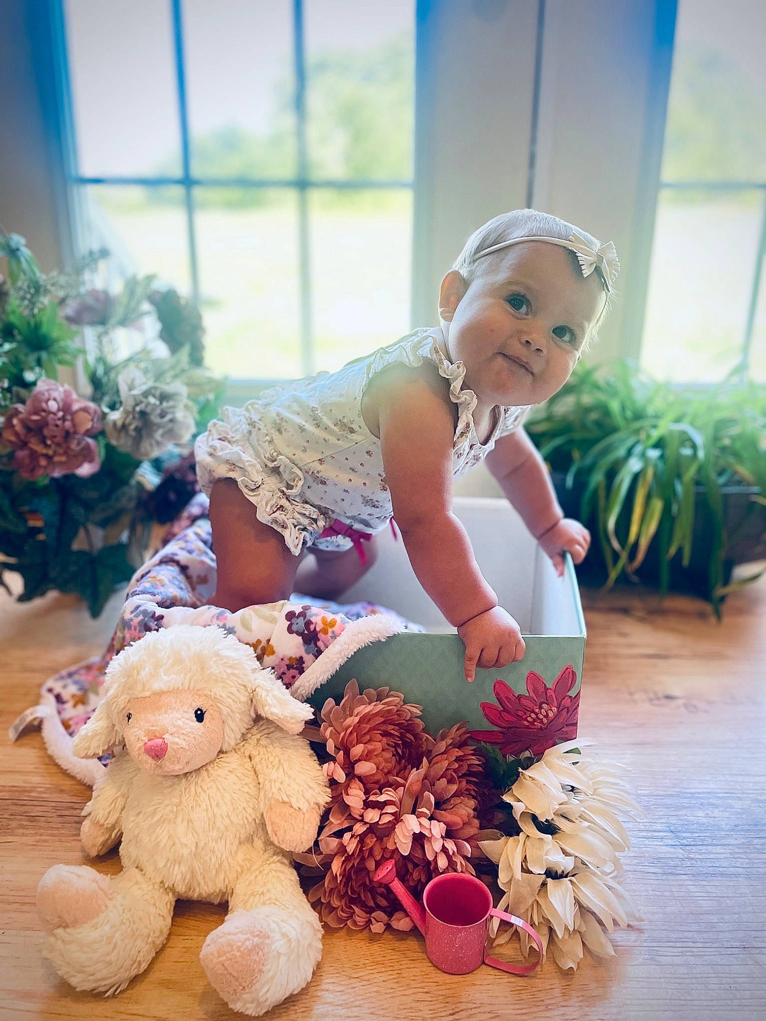 Bailey is registered to the contest to win money with this photo: baby, child, cut_flowers, doll, event, flooring, flower, flower_arranging, happy, headpiece, person, petal, pink, plant, plush, rose, sitting, stuffed_toy, teddy_bear, toddler
