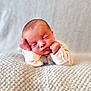 Milann participe au concours pour gagner de l'argent avec cette photo : newborn, baby, sleeping, hands, face, cozy, blanket, cute, infant, peaceful, soft, portrait, child, resting, white_clothing, knitted, closeup, tiny, adorable, calm