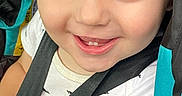 Greyson is registered to the contest to win money with this photo: toddler, child, baby, smiling, happy, portrait, face, blue_eyes, teeth, close_up, car_seat, seatbelt, harness, sitting, white_shirt, patterned_clothing, indoor, vehicle, photography, adorable