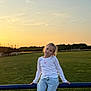 Brianna a rejoint le concours — aidez-le/la à gagner de superbes lots ! child, girl, sunset, outdoor, field, grass, rail, casual, relaxed, smile, nature, sky, clouds, jeans, white_shirt, long_sleeve, portrait, young, scenery, peaceful