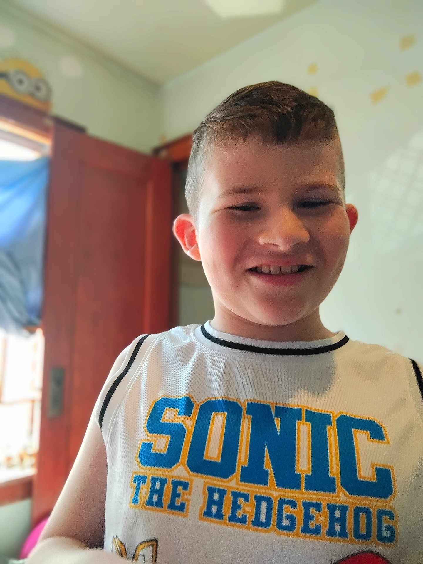 Mycah joined the competition — help win amazing prizes! child, boy, smiling, indoor, tank_top, sonic_the_hedgehog, short_hair, natural_light, window, door, face, casual_clothing, happy, portrait, person, home, young, cute, shirt, childhood