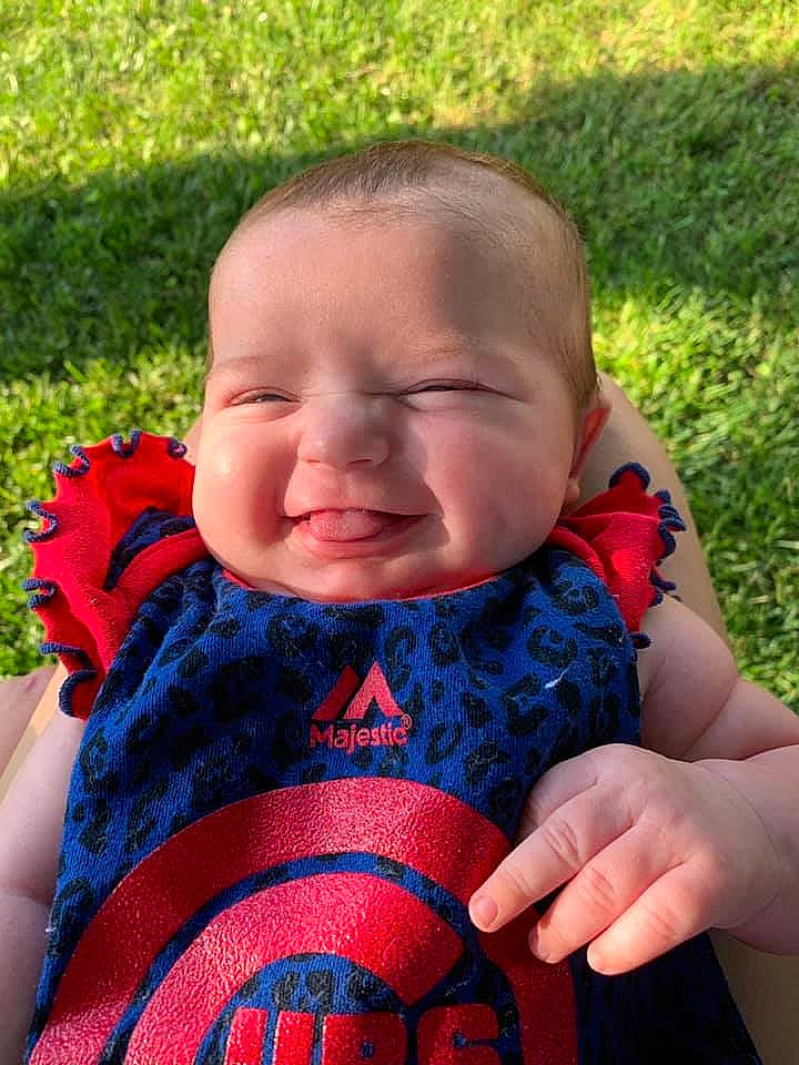 Addison joined the competition — help win amazing prizes! baby, baby_products, cheek, child, facial_expression, finger, grass, hand, joy, mouth, nose, person, play, red, skin, textile, toddler