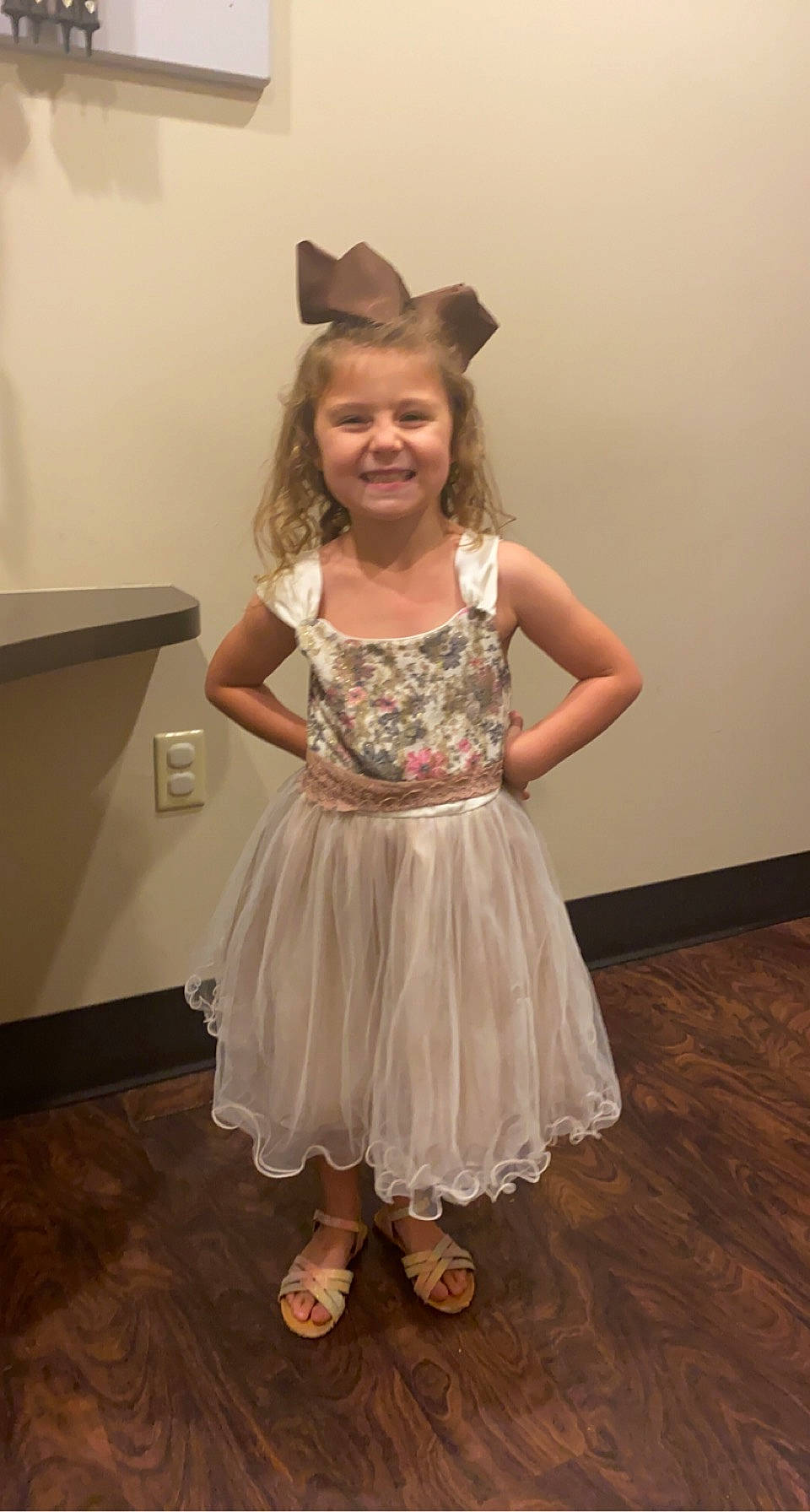 Nova is registered to the contest to win money with this photo: baby_toddler_clothing, day_dress, dress, event, fashion_design, floor, flooring, fun, hair, hairstyle, happy, hardwood, head, human_body, joy, person, shoulder, skin, sleeve, smile