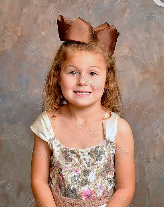 Nova is registered to the contest to win money with this photo: chin, clothing, day_dress, dress, embellishment, eyelash, face, flash_photography, fun, happy, headgear, headpiece, iris, joy, lip, long_hair, person, pink, skin, smile