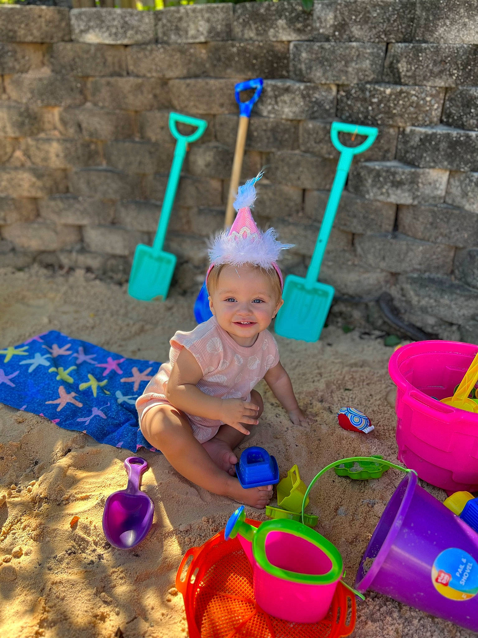 Leilani is registered to the contest to win money with this photo: bucket, child, electric_blue, event, fun, garden_tool, grass, happy, hat, headwear, holiday, joy, magenta, people_in_nature, person, pink, play, recreation, sand, smile