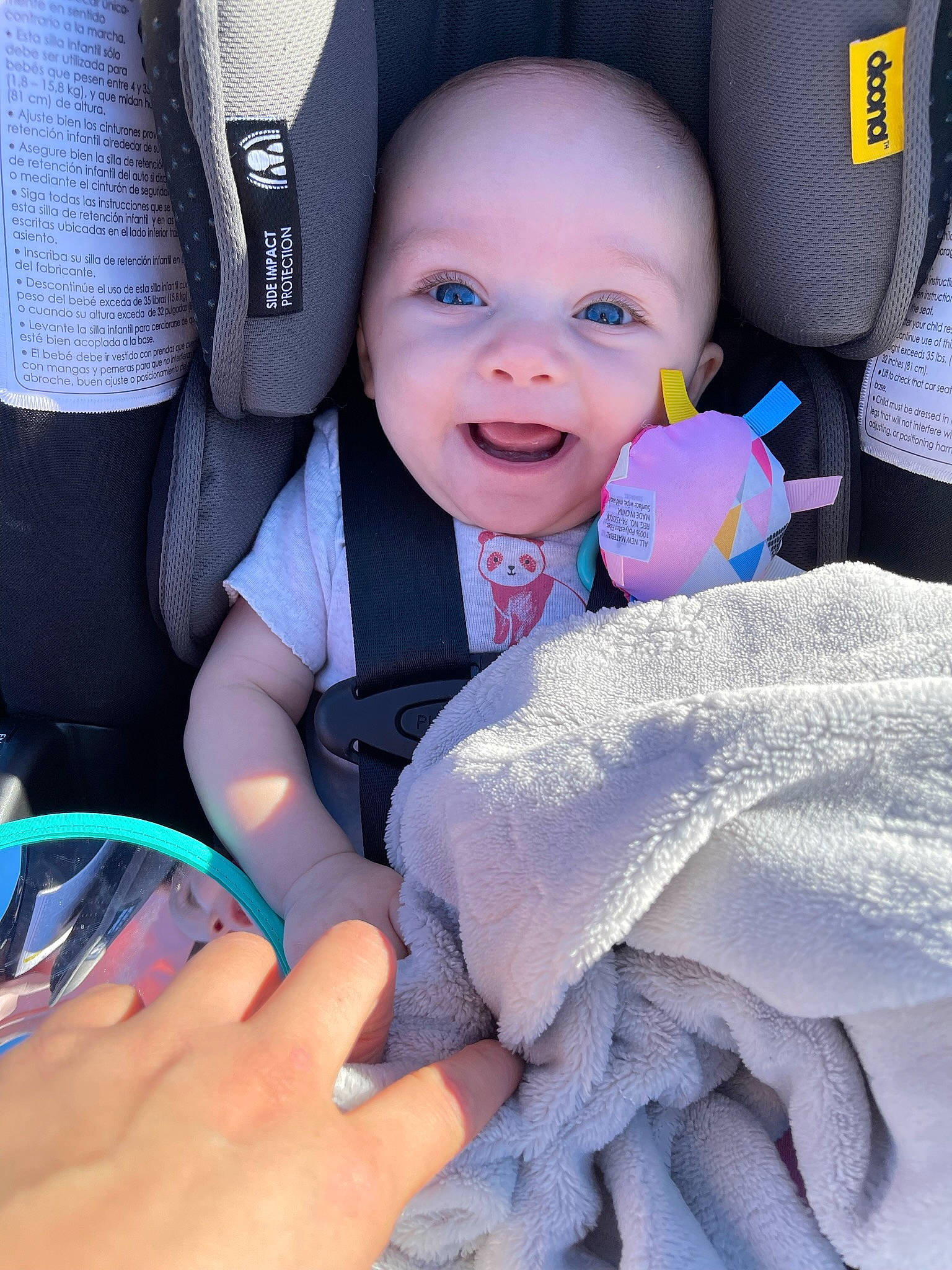 Leilani is registered to the contest to win money with this photo: azure, baby, baby_in_car_seat, baby_toddler_clothing, blue, car_seat, child, comfort, electric_blue, finger, gesture, happy, nail, people, person, product, skin, smile, thumb, toddler