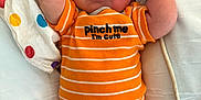 Ryder is registered to the contest to win money with this photo: arm, baby, blanket, child, clothing, cute, face, hand, indoors, infant, lying_down, newborn, onesie, orange, peaceful, polka_dot, resting, sleeping, soft, striped