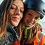 Eloise a rejoint le concours — aidez-le/la à gagner de superbes lots ! woman, child, helmet, orange_vest, smile, selfie, safety_gear, long_hair, jacket, outdoor, person, portrait, headwear, protective_gear, happy, closeup, construction, casual, friendship, together