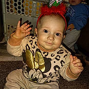 Eleeah joined the competition — help win amazing prizes! toddler, child, baby, festive_hat, minnie_mouse, golden_bow, leopard_print, carpet, indoor, baby_gate, blue_hoodie, curious, waving, pom_pom, sitting, cute, smiling, clothing, young_child, portrait