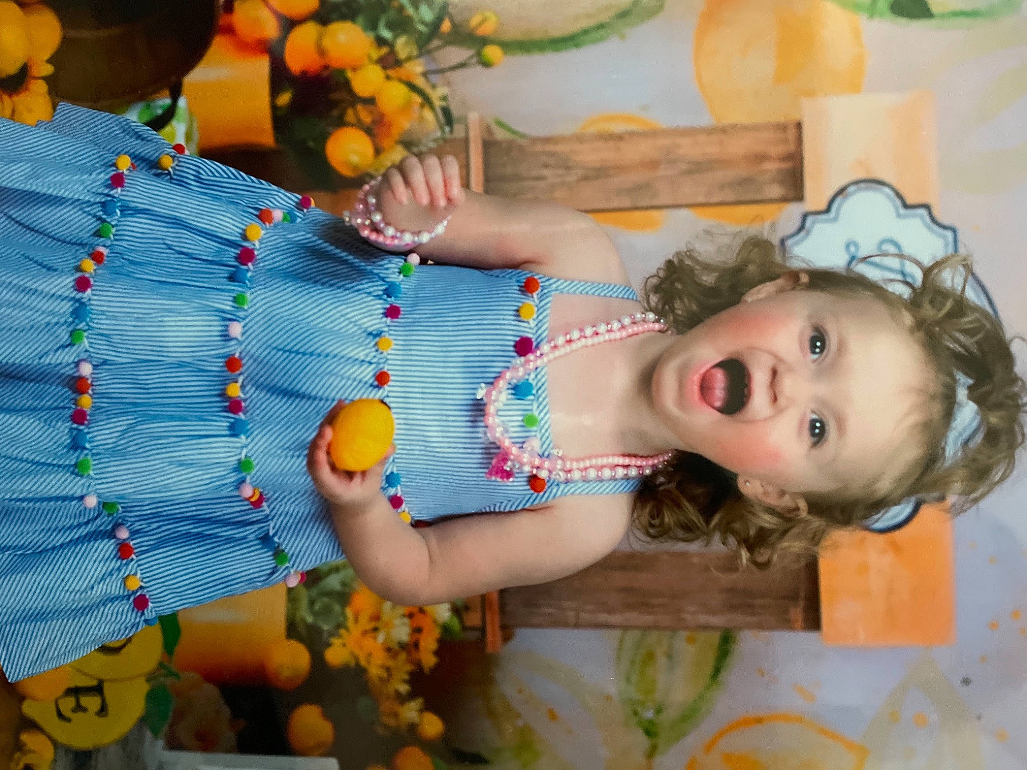 Harper is registered to the contest to win money with this photo: abdomen, beauty, child, dress, fun, green, happy, jewellery, natural_foods, orange, pattern, people, people_in_nature, person, photograph, plant, spring, summer, toddler, trunk