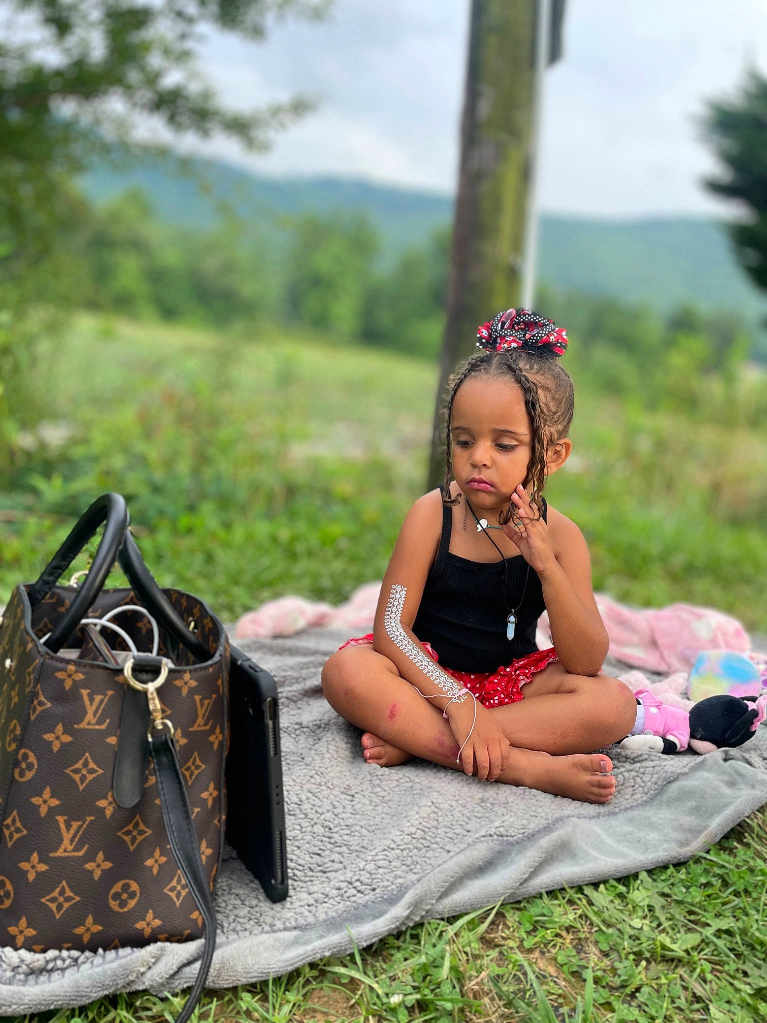 Jordynn Nichole-khaliana is registered to the contest to win money with this photo: bag, doll, dress, event, fawn, grass, grassland, green, happy, leisure, luggage_and_bags, meadow, pattern, people_in_nature, person, plant, shoe, shoulder_bag, sky, toy