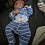 baby, sleeping, onesie, blue_stripes, bear_design, blanket, infant, child, cute, cozy, soft, resting, peaceful, portrait, bedtime, clothing, person, indoors, newborn, footed_pajamas