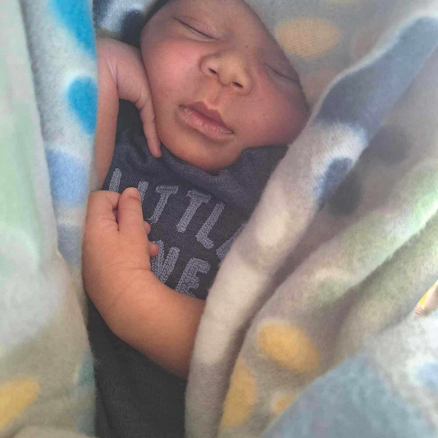 Tidus is registered to the contest to win money with this photo: baby, blanket, child, closeup, comfort, cozy, cute, face, hand, infant, newborn, peaceful, portrait, resting, skin, sleeping, soft, toddler, warm, wrapped