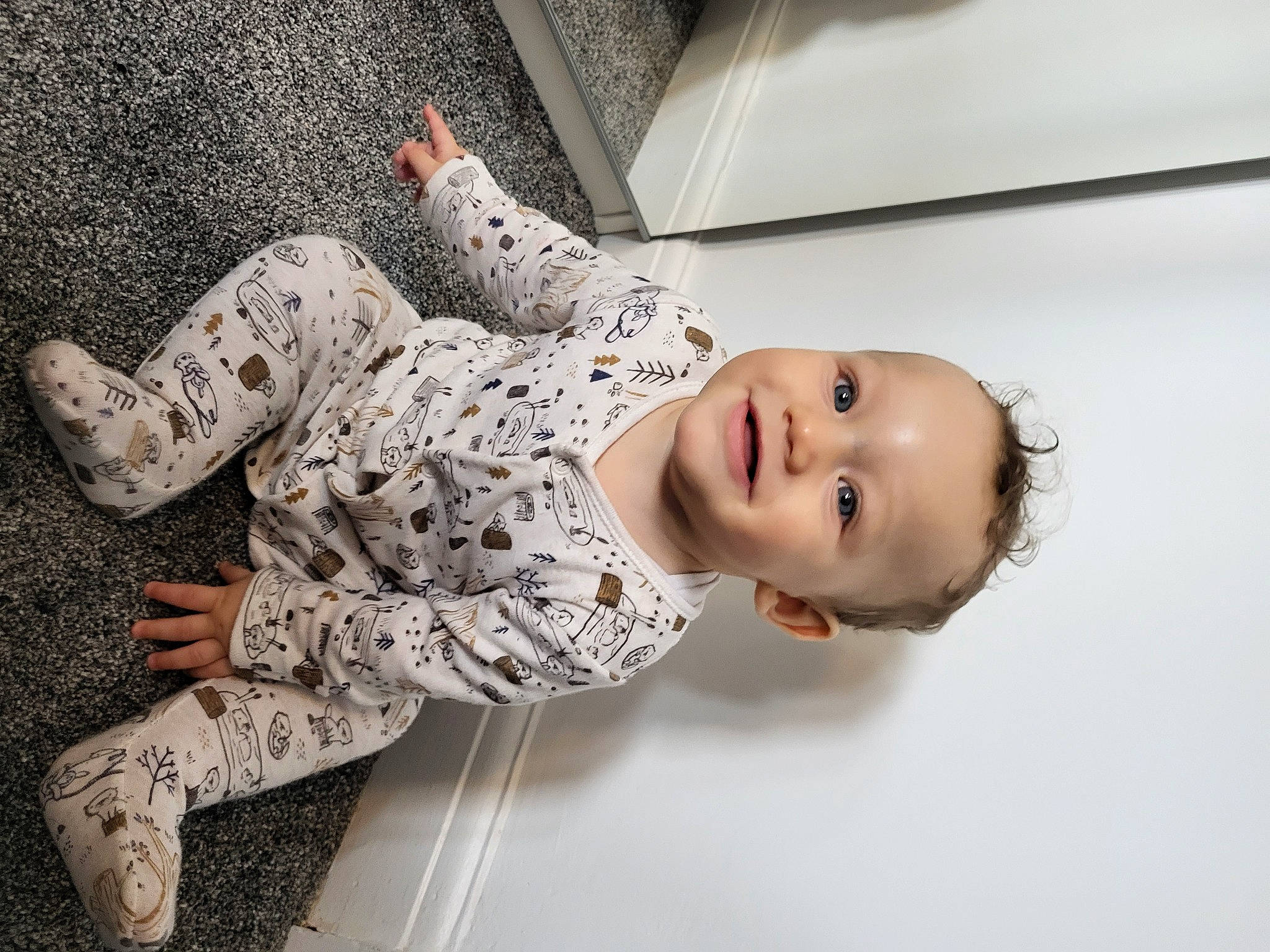 Harrison is registered to the contest to win money with this photo: baby, child, elbow, flash_photography, flooring, foot, fun, happy, human_leg, joy, leg, pattern, person, portrait_photography, room, sitting, sleeve, smile, toddler, wood
