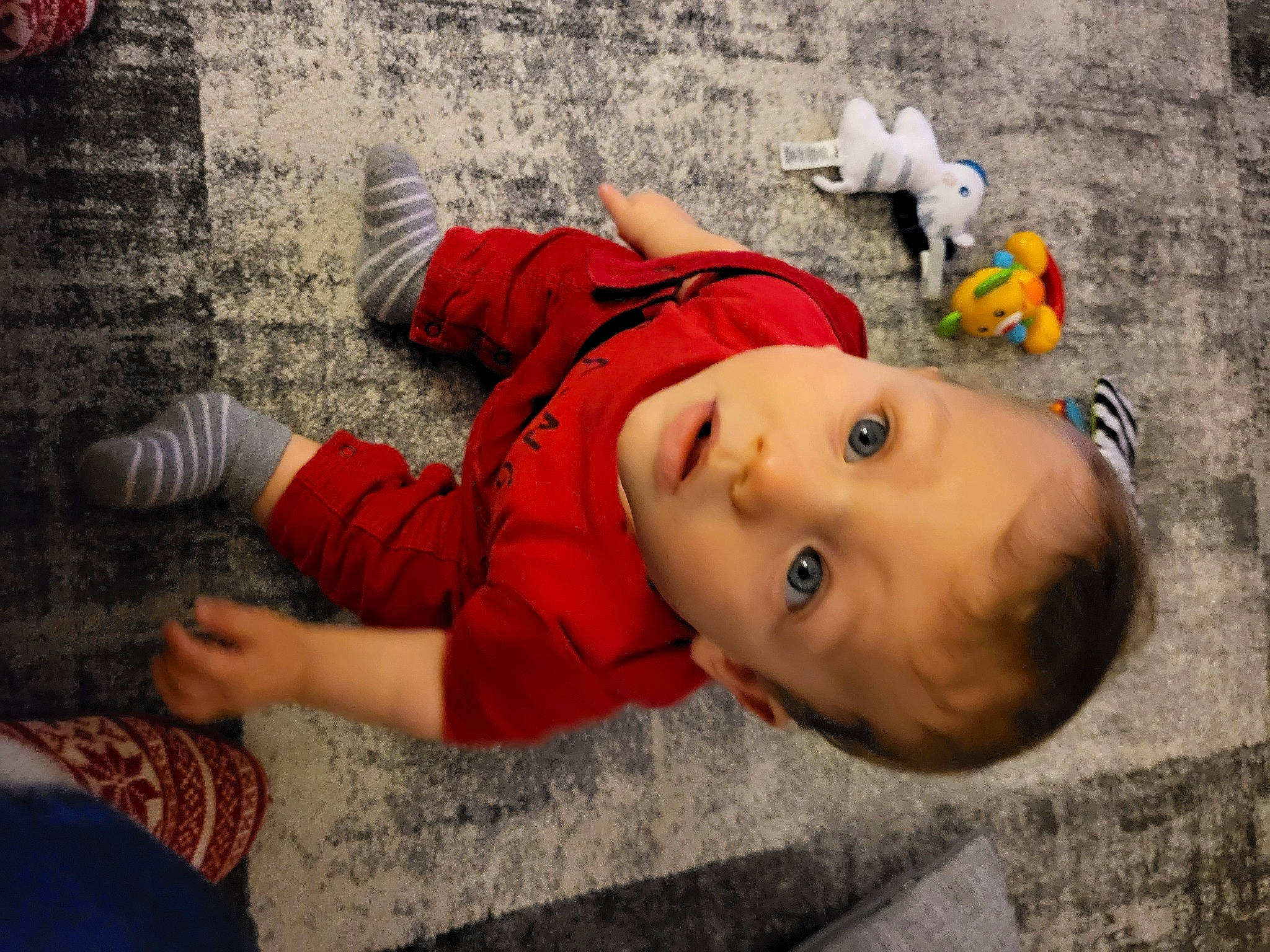 Harrison joined the competition — help win amazing prizes! baby, baby_toddler_clothing, child, fun, grass, happy, hat, leisure, orange, person, personal_protective_equipment, plant, play, sitting, surprise, toddler, vacation, winter, wood