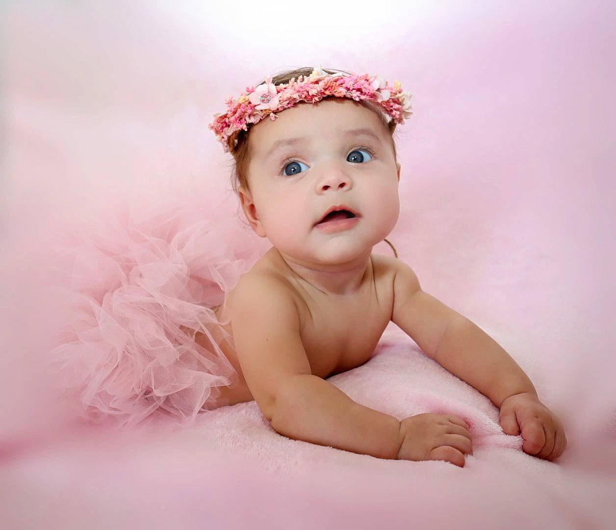 Kayle is registered to the contest to win money with this photo: baby, baby_toddler_clothing, ear, eye, face, fashion_accessory, flash_photography, hair_accessory, happy, head, headband, headgear, headpiece, headwear, iris, jewellery, lip, person, petal, pink