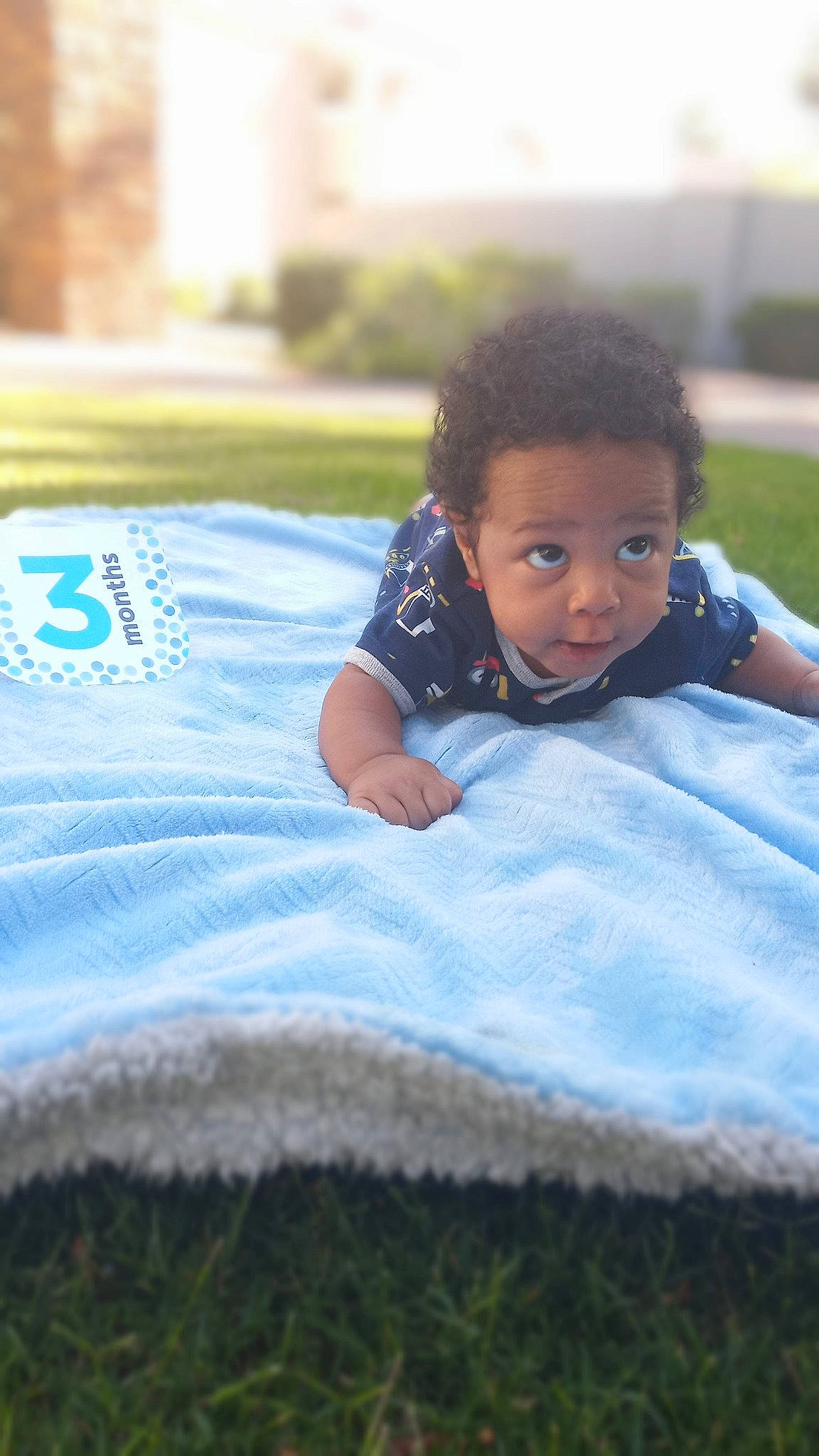 Heir is registered to the contest to win money with this photo: baby, beauty, blue, child, eye, face, fun, grass, green, happy, head, leisure, person, skin, smile, summer, textile, toddler, tree, vacation