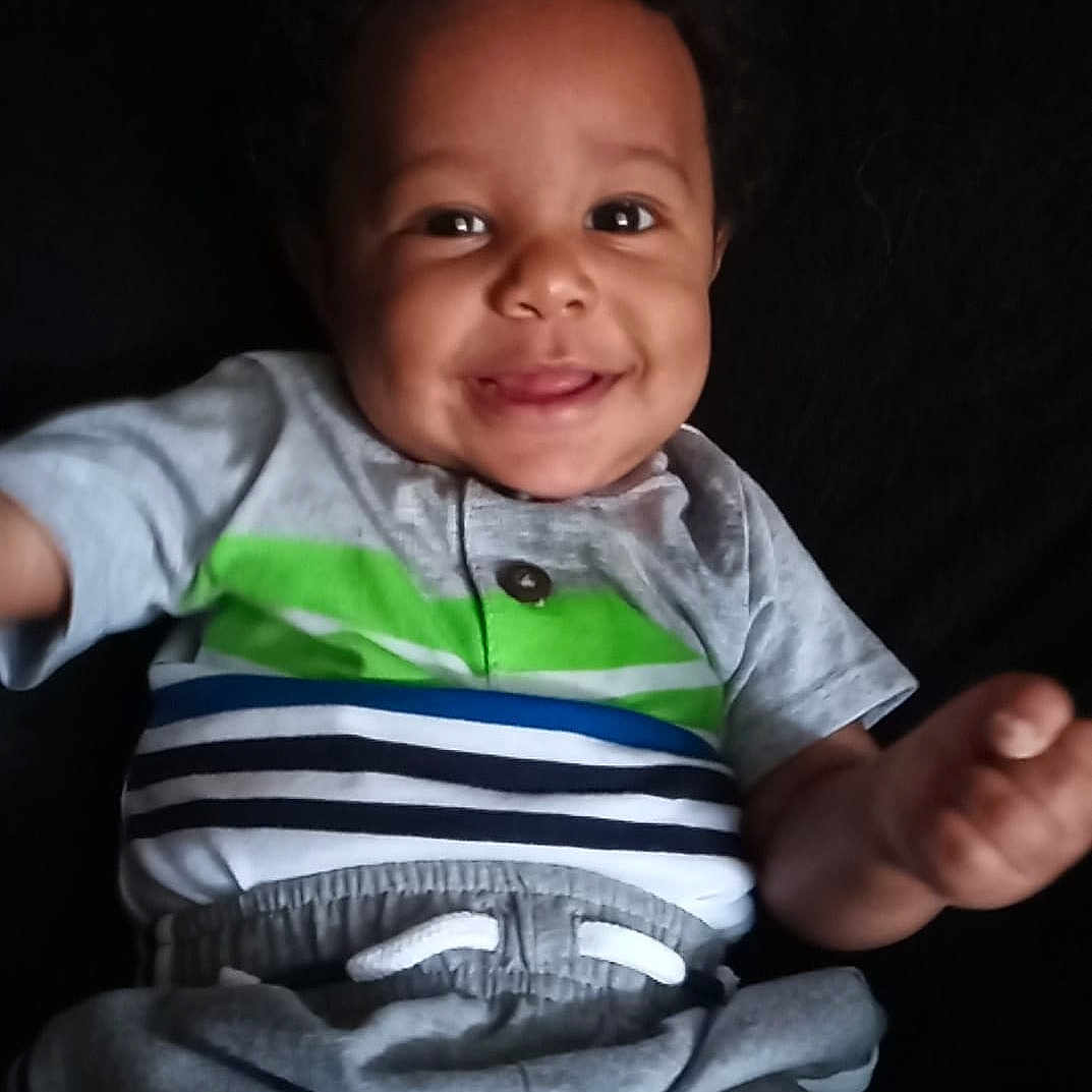 Heir joined the competition — help win amazing prizes! arm, baby, cheek, child, chin, face, facial_expression, finger, fun, gesture, hand, joy, person, sitting, skin, smile, thumb, toddler, vacation