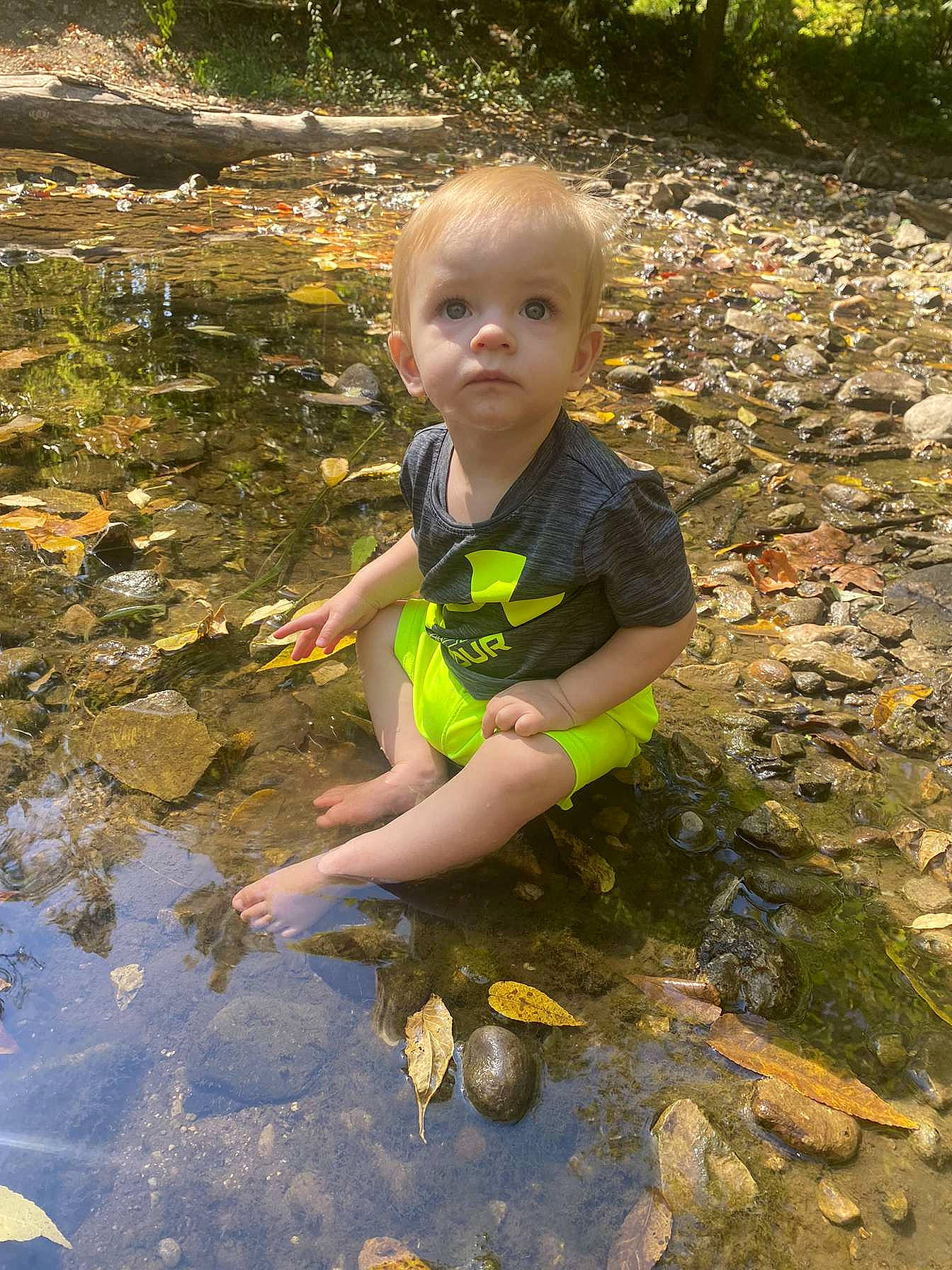 Salem is registered to the contest to win money with this photo: adaptation, baby_toddler_clothing, bank, child, fun, garden, grass, head, landscape, leisure, people_in_nature, person, plant, rock, soil, stream, toddler, water, watercourse, wilderness
