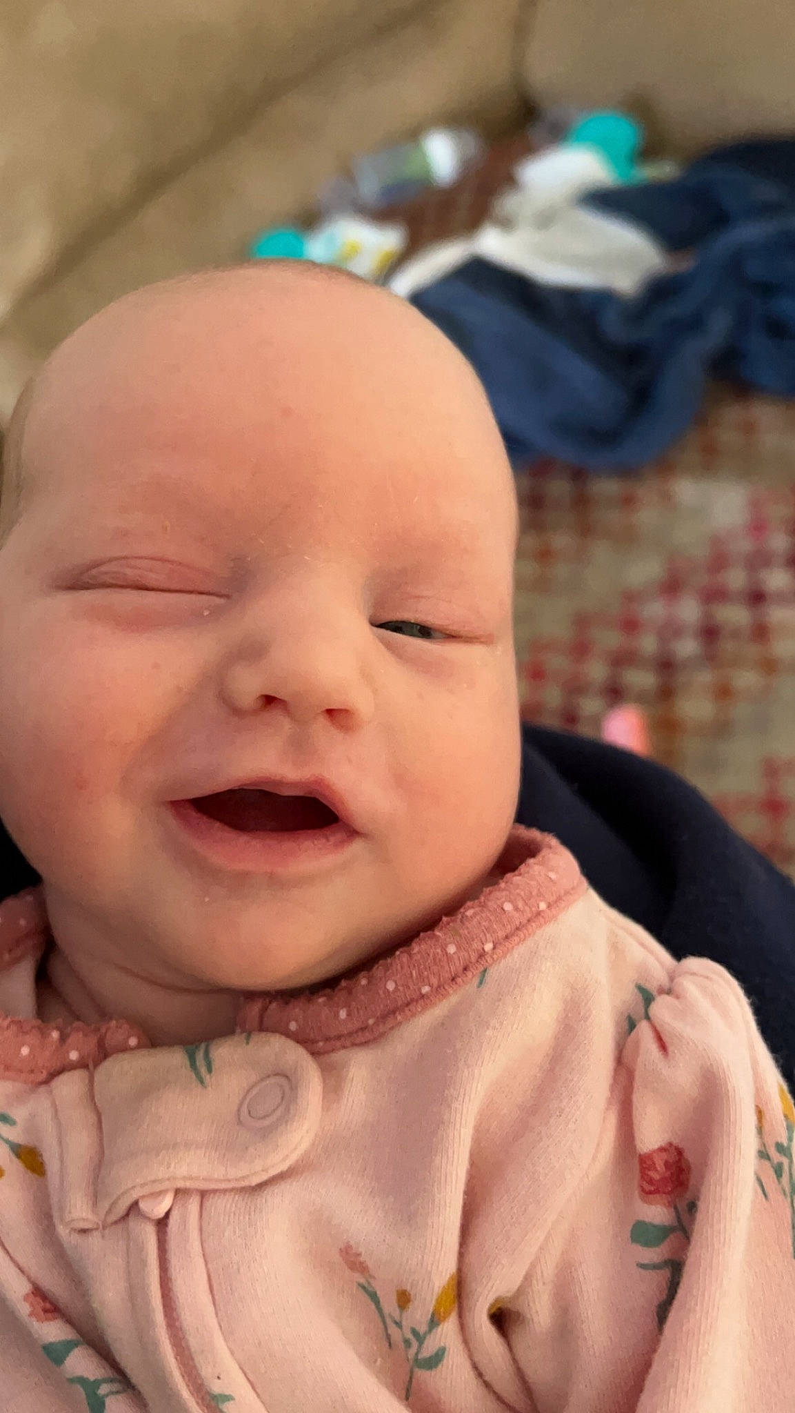 Bella is registered to the contest to win money with this photo: baby, baby_toddler_clothing, cheek, chin, dress, eye, eyebrow, happy, head, human_body, iris, lip, mouth, nose, person, photograph, pink, skin, sleeve, smile