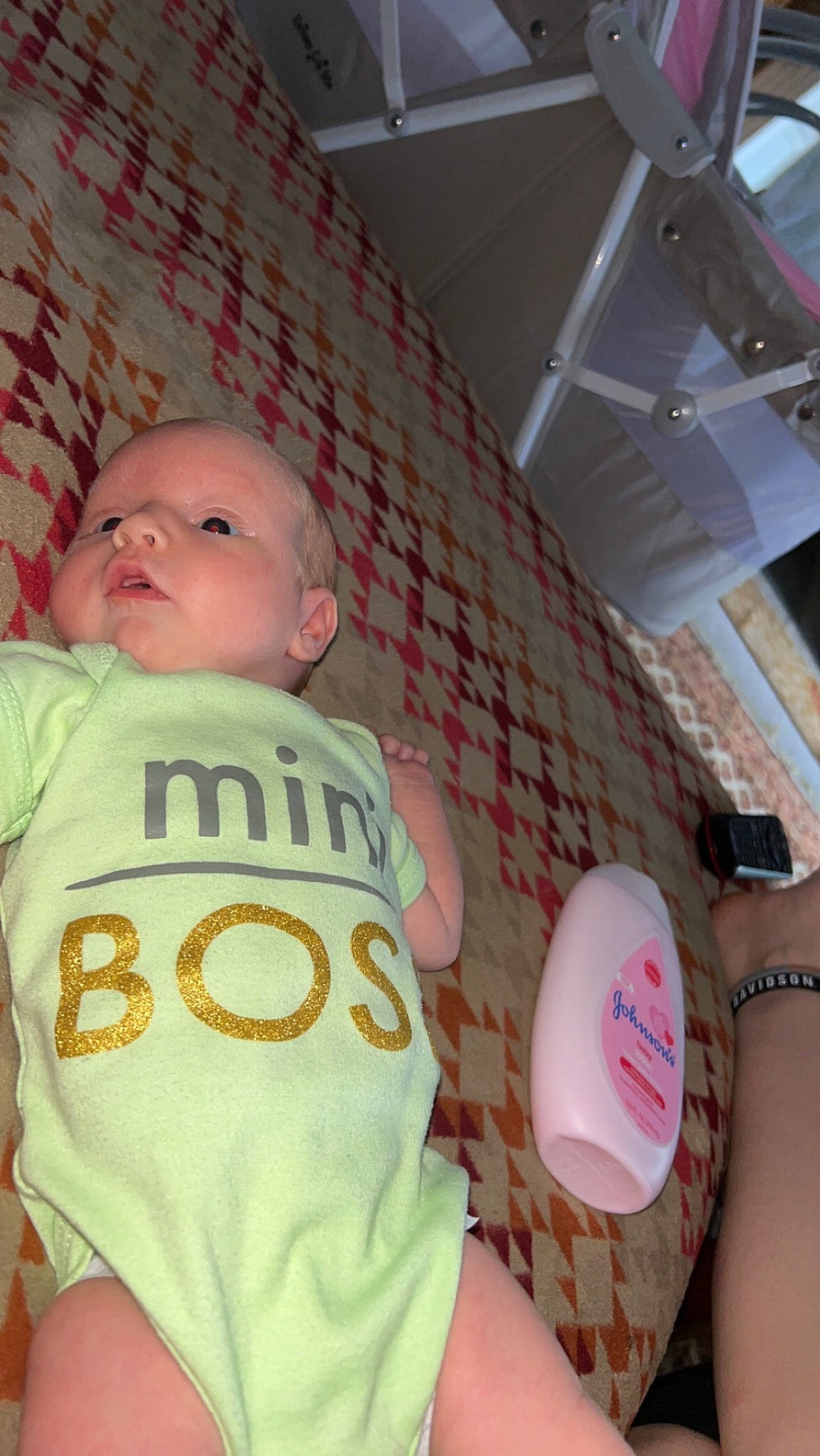 Bella is registered to the contest to win money with this photo: baby, baby_products, baby_sleeping, baby_toddler_clothing, balloon, ceiling, child, circle, comfort, flooring, fun, happy, person, pink, room, selfie, sitting, skin, sleeve, t_shirt