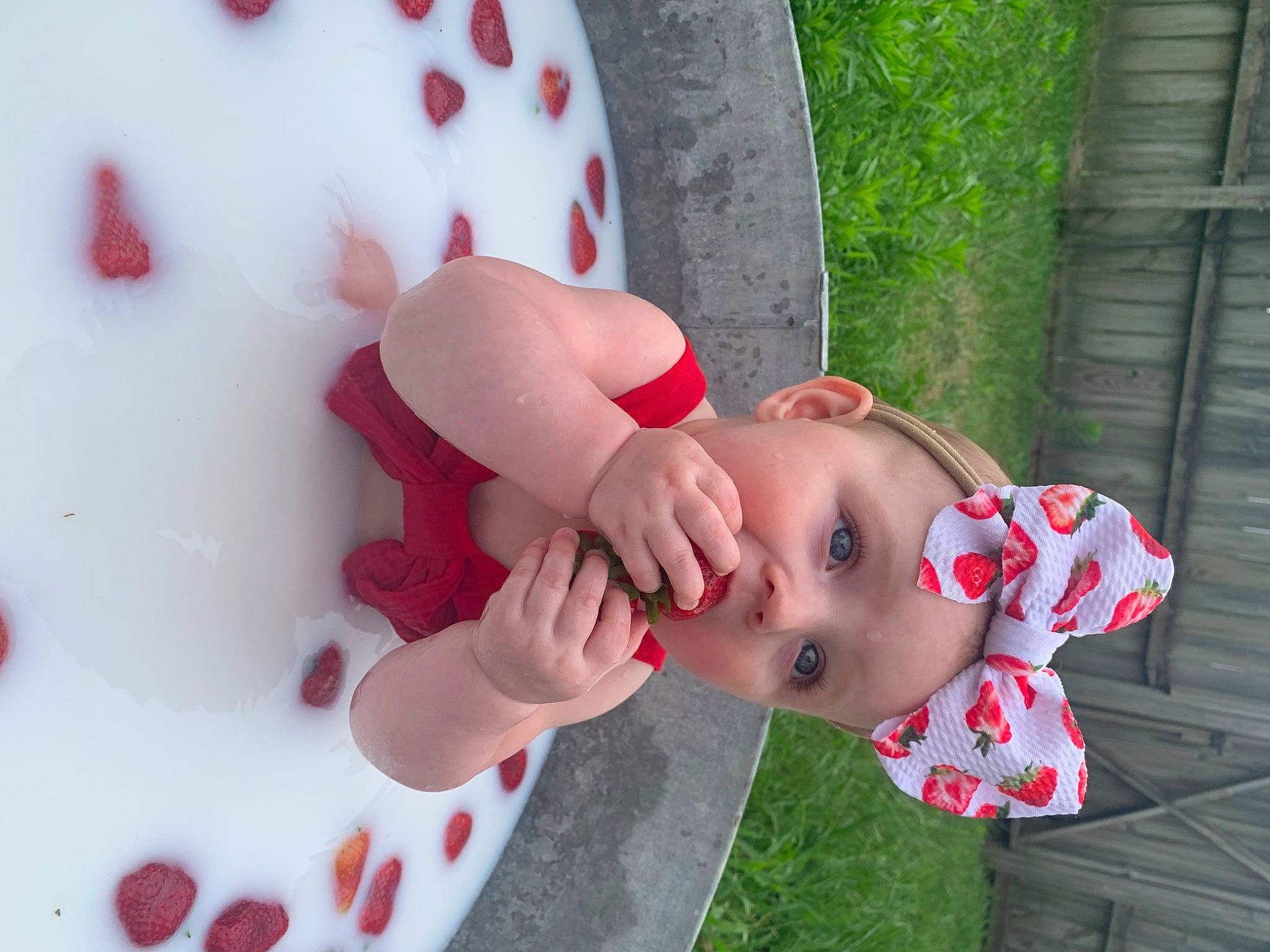 Willow is registered to the contest to win money with this photo: baby, baby_toddler_clothing, carmine, child, fun, grass, happy, head, headwear, human_body, leisure, lip, pattern, person, pink, plant, recreation, red, skin, toddler