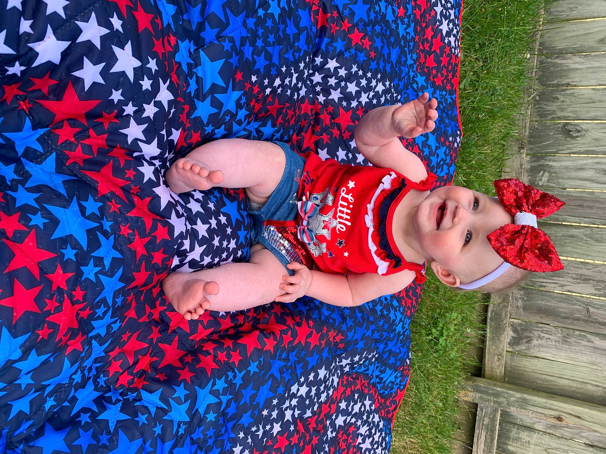 Willow is registered to the contest to win money with this photo: arm, beauty, blue, carmine, denim, electric_blue, fun, grass, happy, hat, headwear, human_leg, joy, leisure, pattern, people_in_nature, person, recreation, red, smile