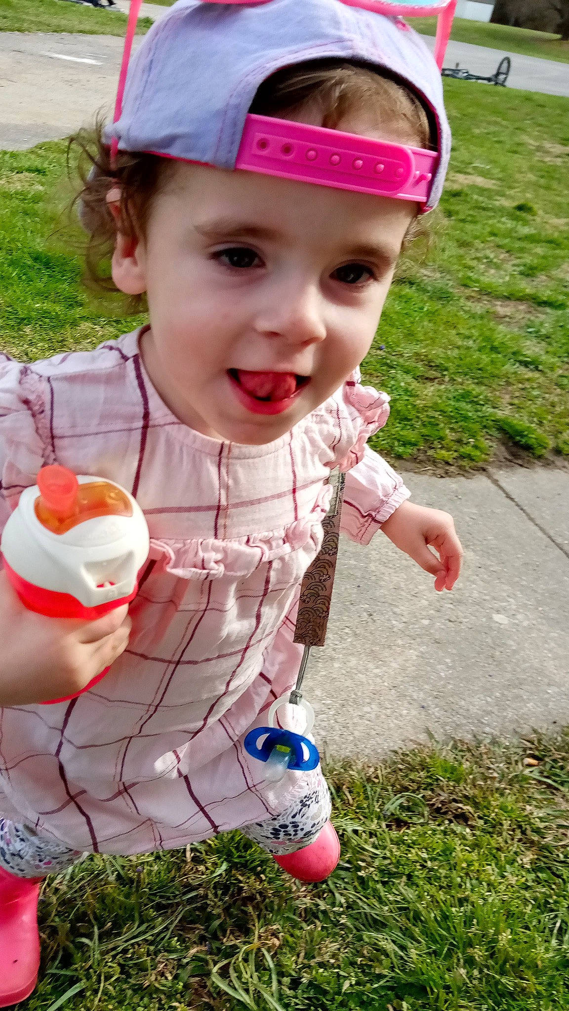 Addison joined the competition — help win amazing prizes! baby_toddler_clothing, cap, child, fashion_accessory, fun, grass, green, happy, headgear, headwear, leisure, magenta, pattern, people, people_in_nature, person, personal_protective_equipment, pink, recreation, skin