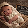 Hudson joined the competition — help win amazing prizes! baby, newborn, infant, baseball, baseball_glove, baseball_bat, cap, wooden_box, blanket, chalkboard, sign, cozy, portrait, rustic, wood_background, brown_tones, hand, face, eyes_open, soft_texture
