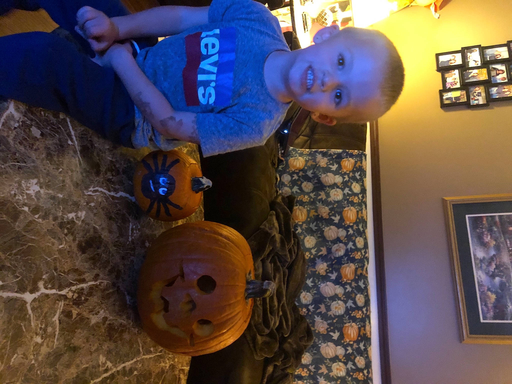 Kayden is registered to the contest to win money with this photo: art, automotive_tire, automotive_wheel_system, blue, calabaza, electric_blue, fun, hat, person, picture_frame, pumpkin, room, soil, t_shirt, toddler, toy, tree, vegetable, visual_arts, winter_squash