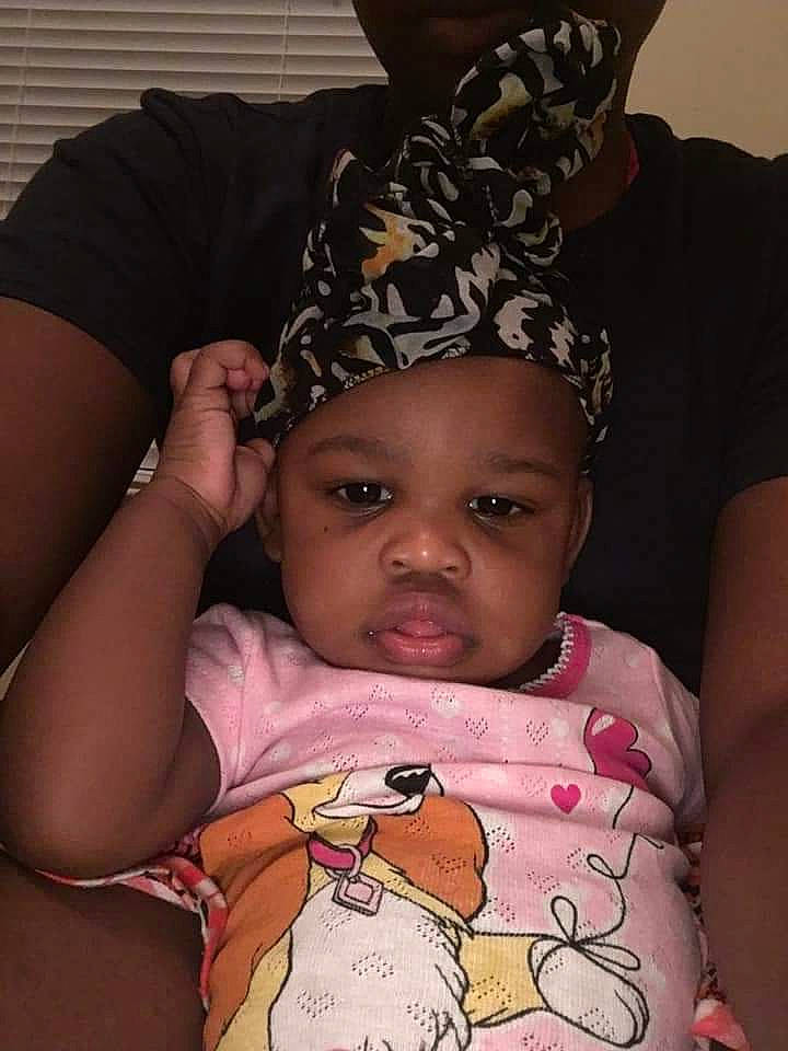 Jada is registered to the contest to win money with this photo: arm, baby, birth, cheek, child, ear, face, hair_accessory, head, headgear, headwear, lip, neck, person, toddler