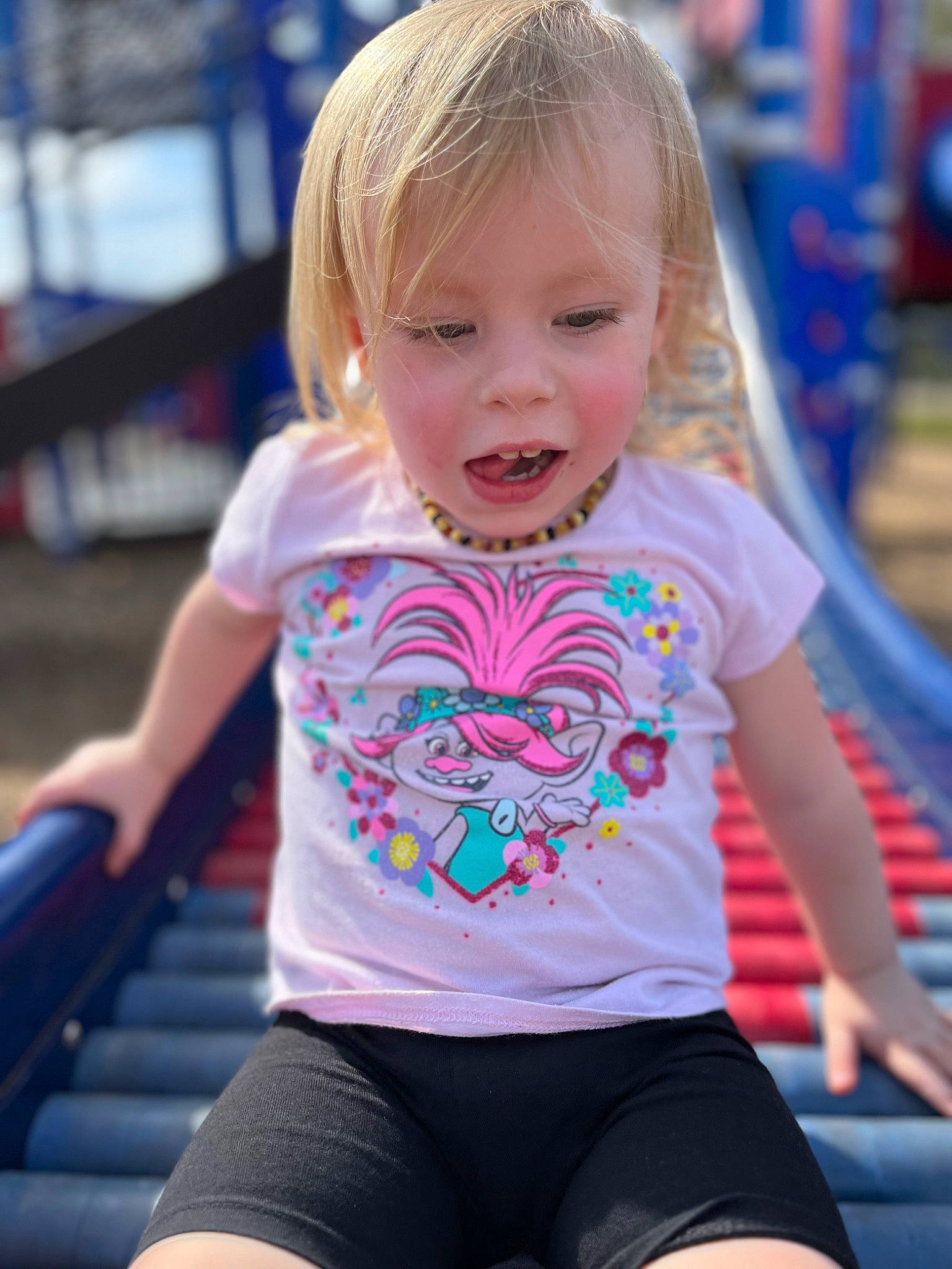 Laionna is registered to the contest to win money with this photo: baby_toddler_clothing, blond, blue, child, electric_blue, fun, grass, happy, leisure, person, pink, recreation, skin, sleeve, smile, sportswear, standing, t_shirt, thigh, toddler