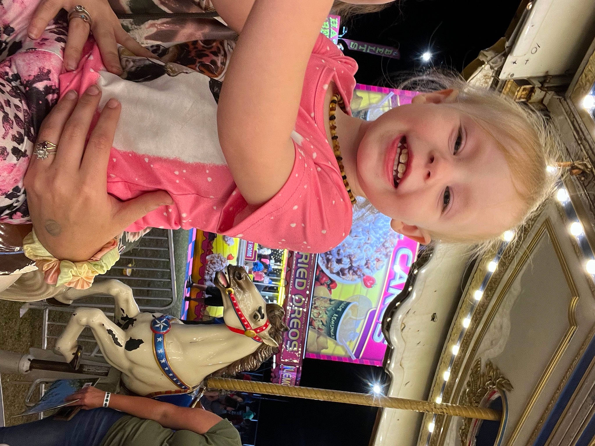Laionna is registered to the contest to win money with this photo: amusement_ride, automotive_wheel_system, beauty, child, cool, fashion_accessory, fun, happy, joy, laugh, leisure, magenta, necklace, pattern, person, pink, product, recreation, skin, smile