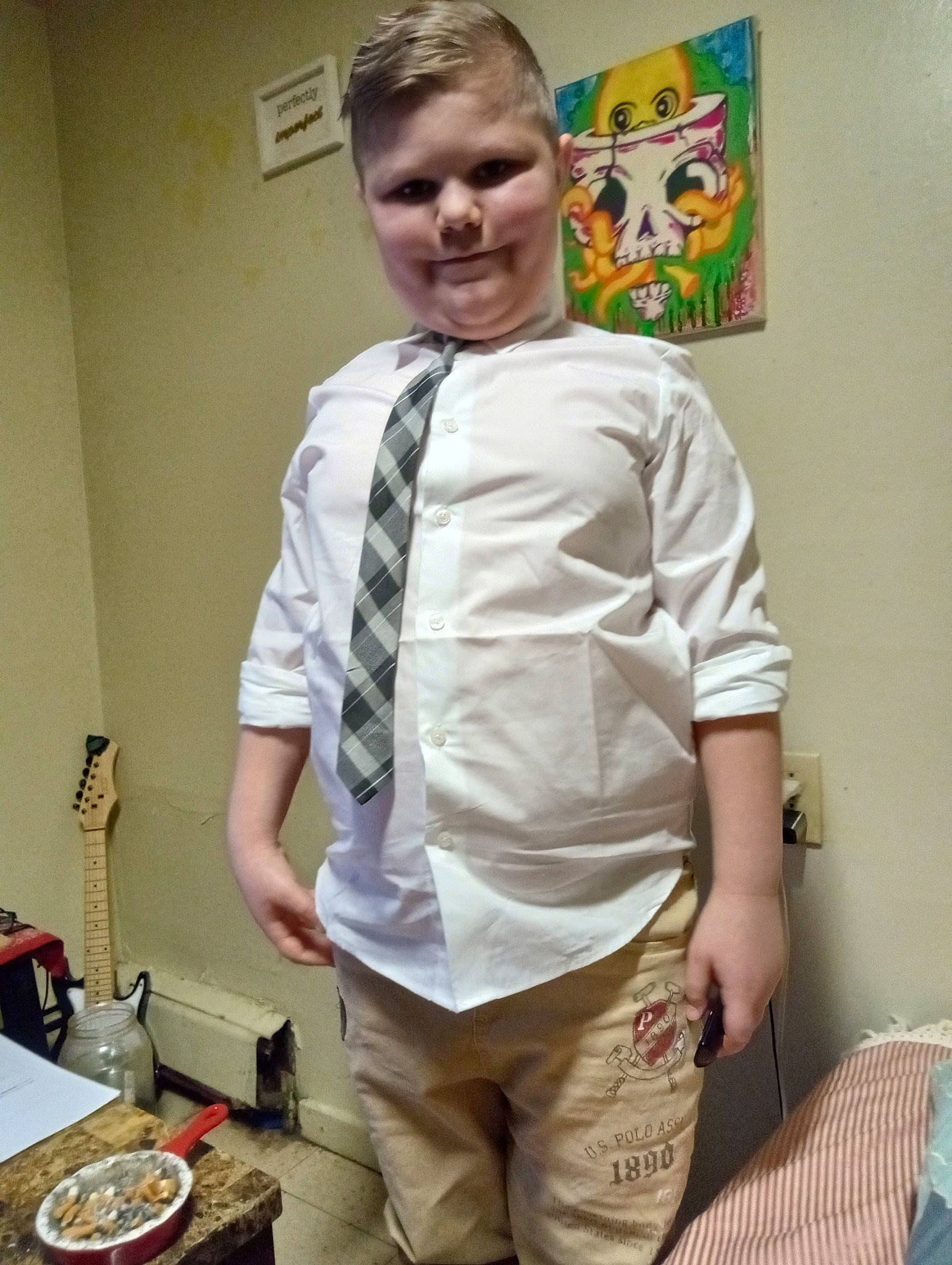 Ephraim is registered to the contest to win money with this photo: art, belt, child, collar, cooking, cuisine, dress_shirt, eyewear, fashion_design, formal_wear, joy, kitchen, pattern, person, plate, room, sleeve, t_shirt, tableware, tie