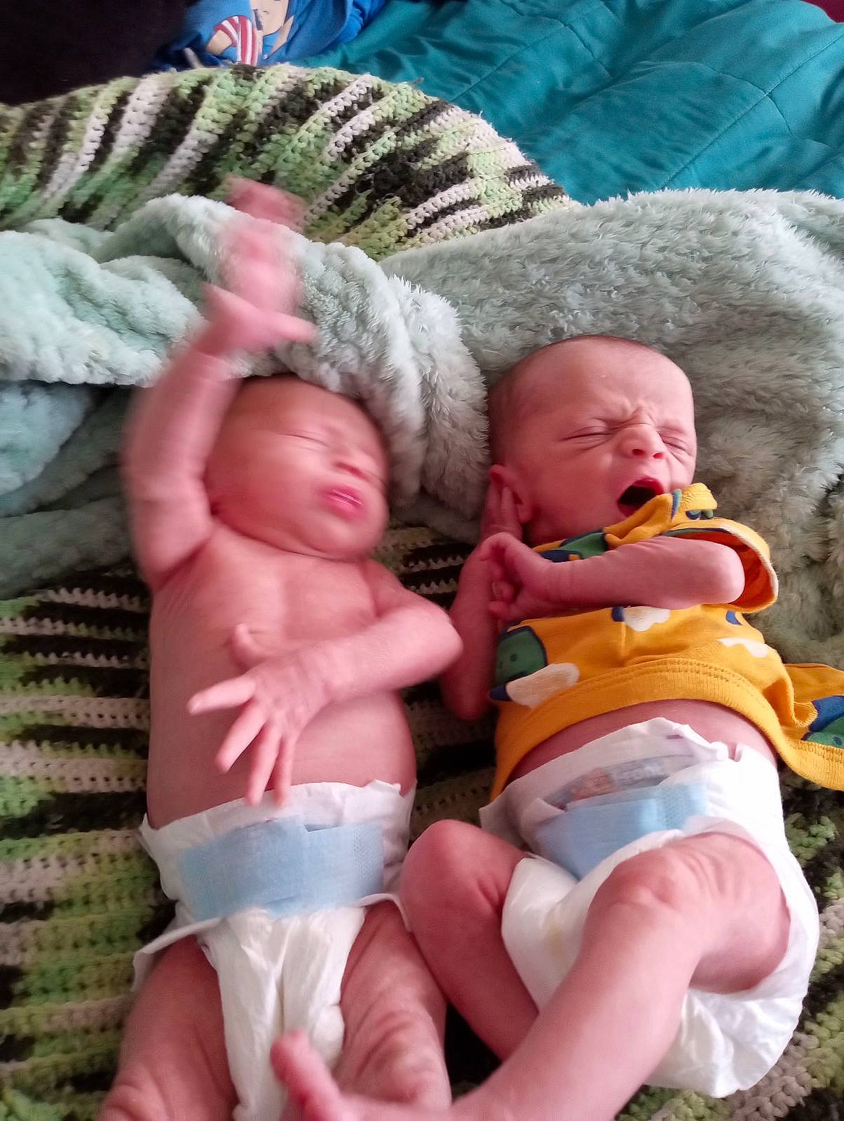 Winter is registered to the contest to win money with this photo: abdomen, baby, cheek, chest, child, comfort, eye, finger, foot, grass, green, lap, mammal, person, skin, stomach, textile, thigh, thumb, toddler